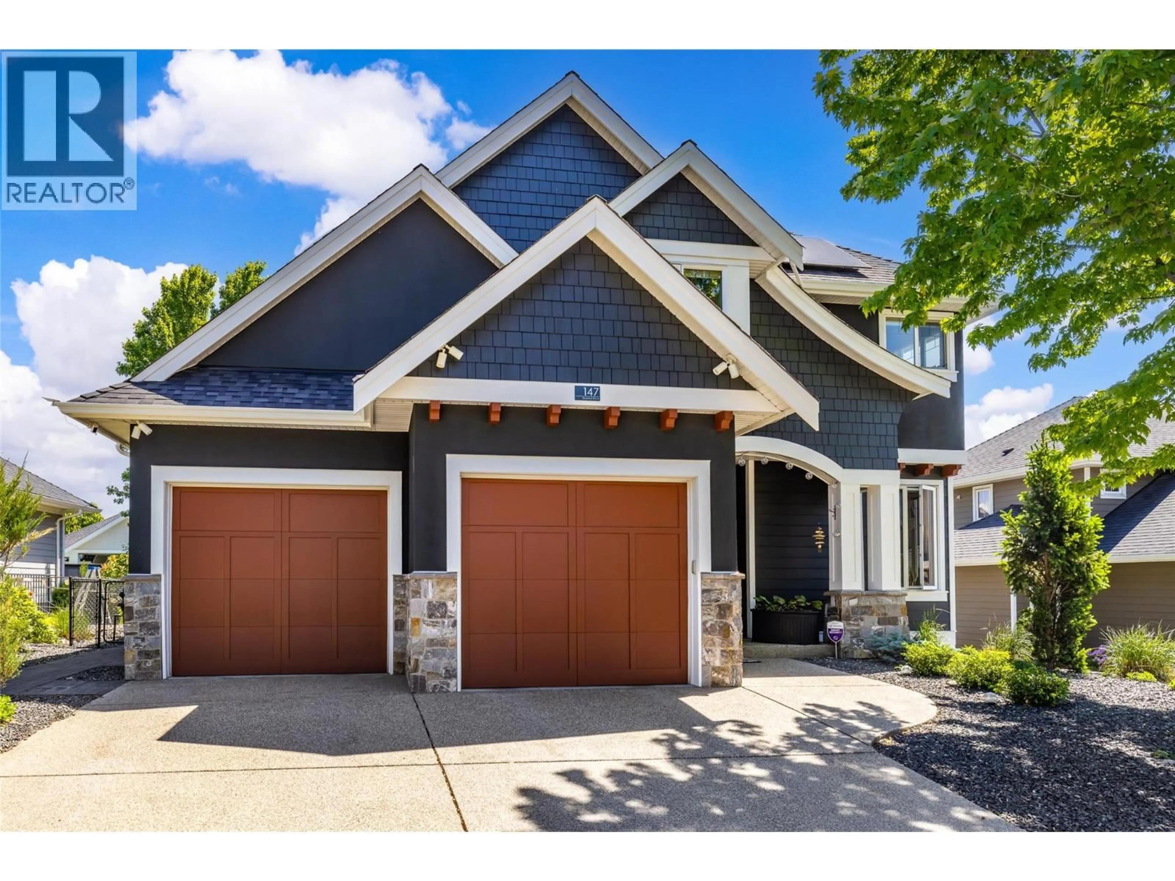 Home with brick exterior material, street for 147 SKYLAND DRIVE, Kelowna British Columbia V1V3A2