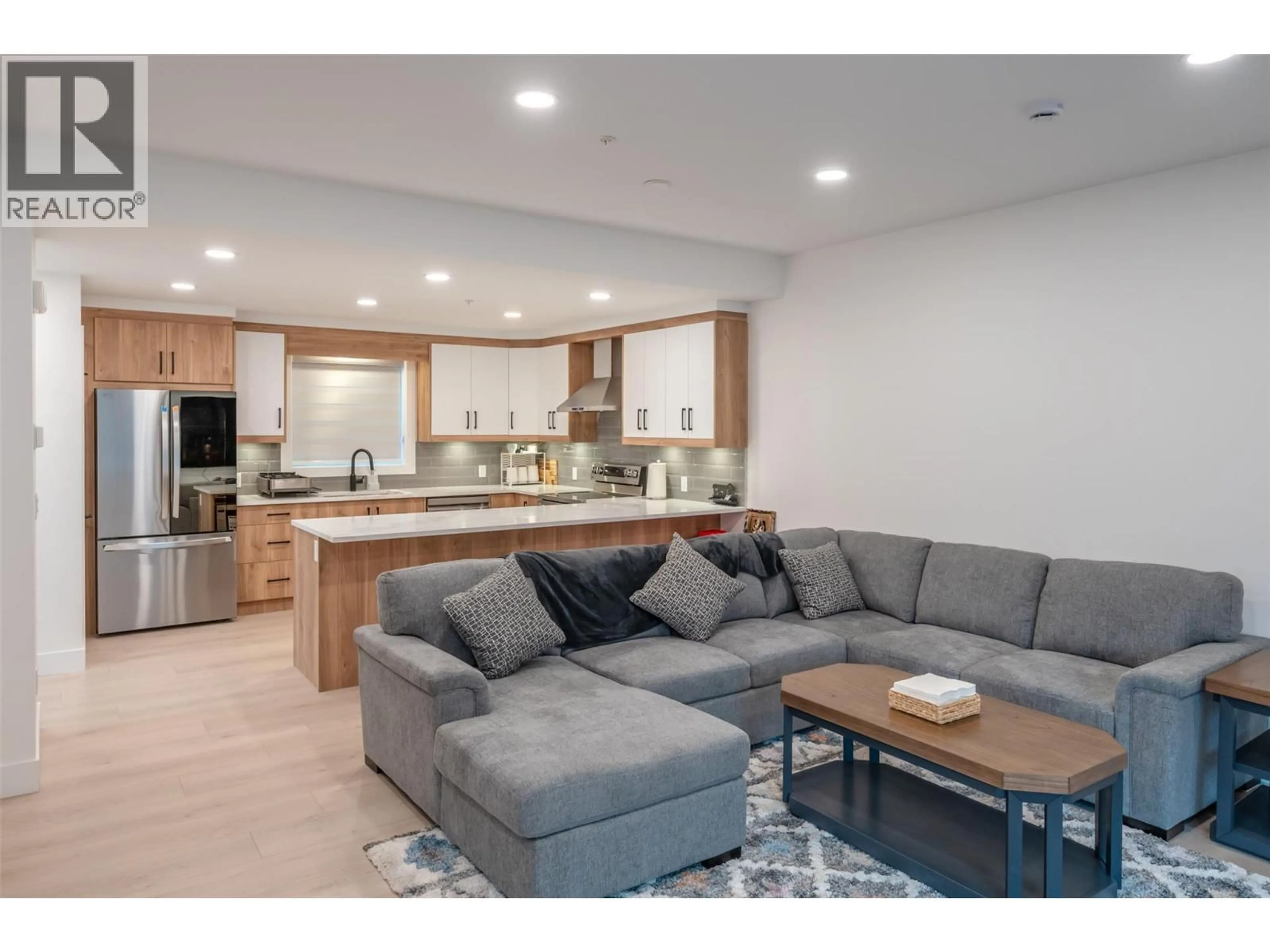 Open concept kitchen, wood/laminate floor for 110 - 10615 ELLIOTT STREET, Summerland British Columbia V0H1Z2