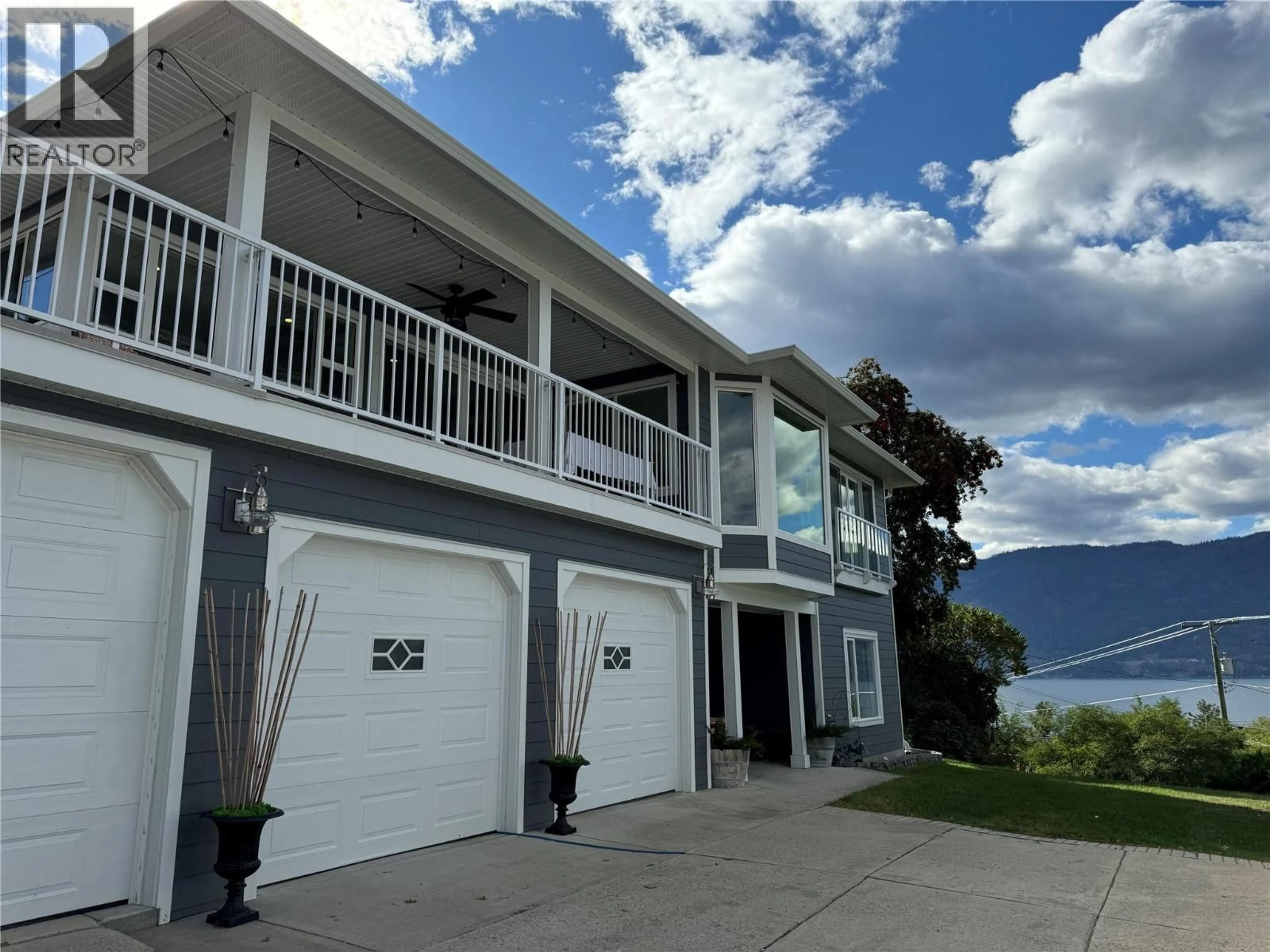A pic from outside/outdoor area/front of a property/back of a property/a pic from drone, water/lake/river/ocean view for 11935 OKANAGAN CENTRE ROAD WEST, Lake Country British Columbia V4V2H5