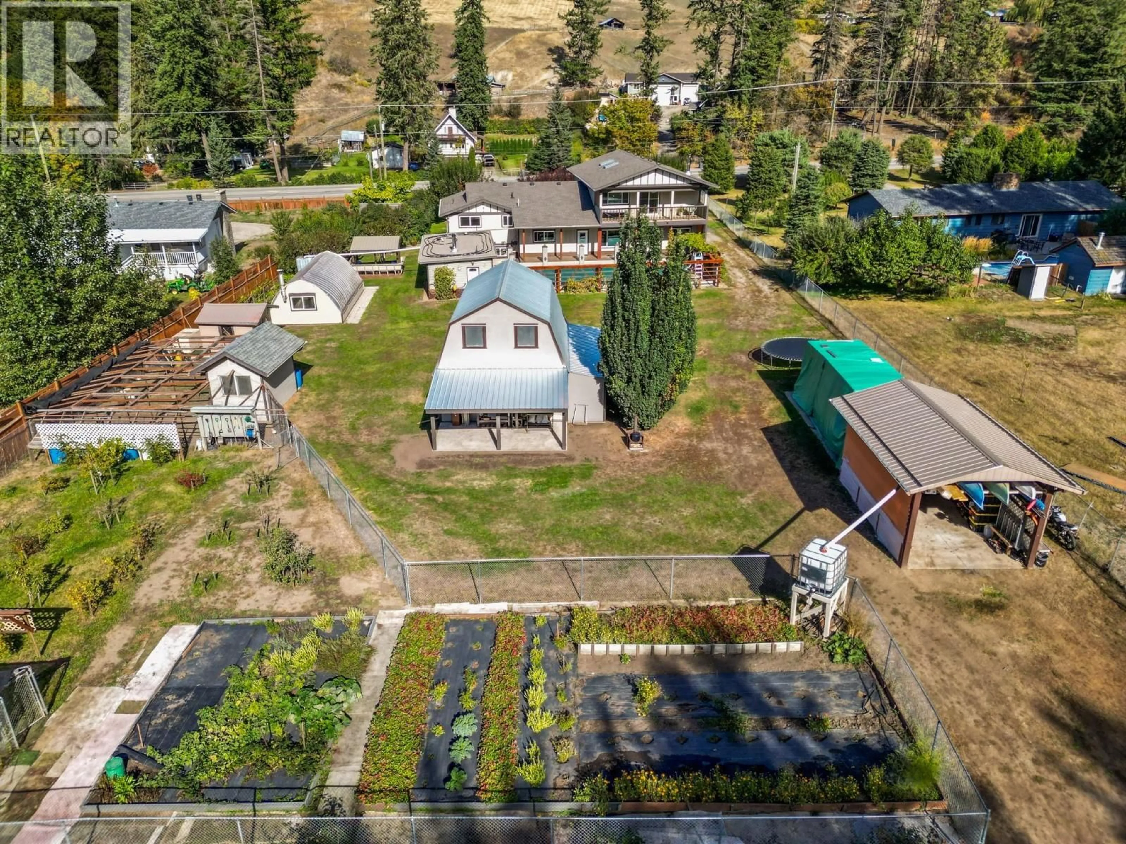A pic from outside/outdoor area/front of a property/back of a property/a pic from drone, unknown for 5936 HIGHWAY 6 OTHER, Coldstream British Columbia V1B1C8