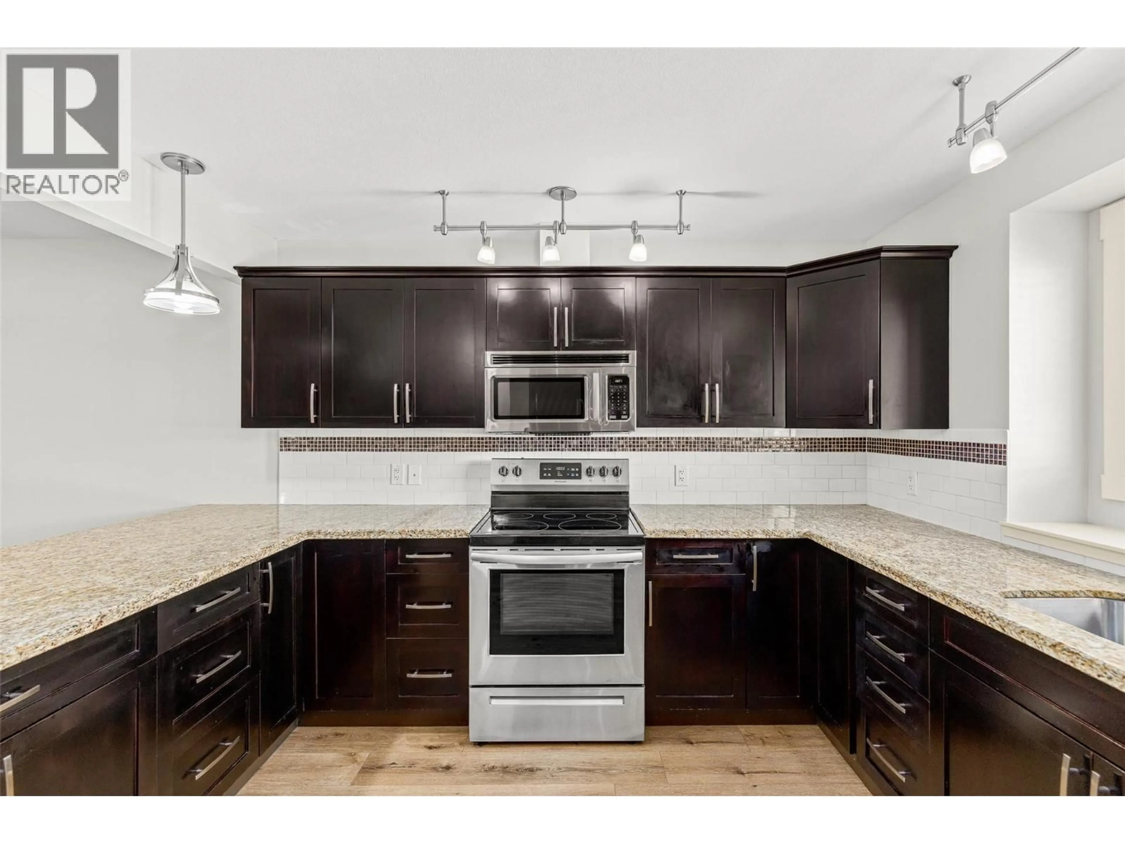 Open concept kitchen, unknown for 105 - 1651 LYNRICK ROAD, Kelowna British Columbia V1P1E8