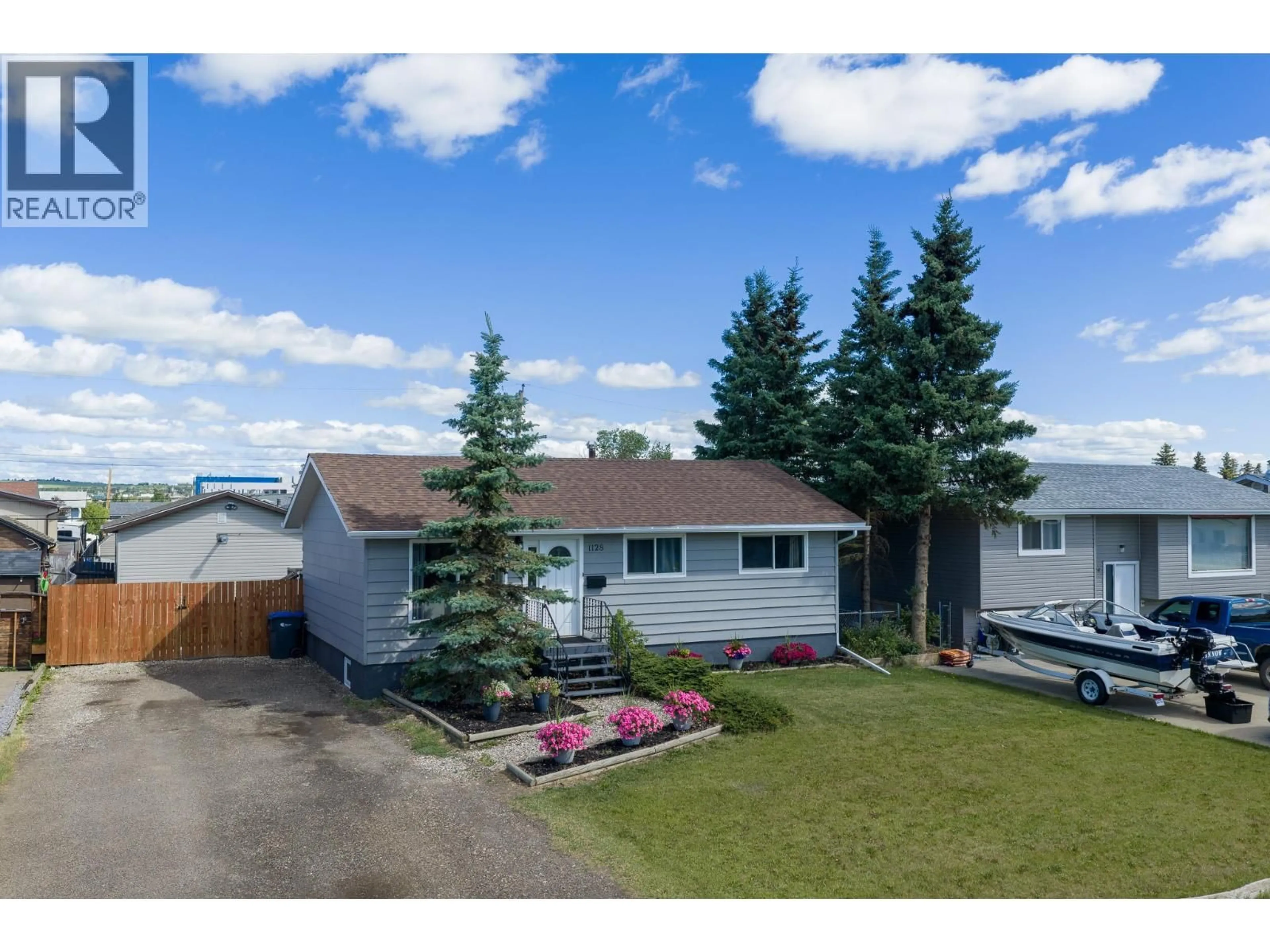 A pic from outside/outdoor area/front of a property/back of a property/a pic from drone, street for 1128 118 AVENUE, Dawson Creek British Columbia V1G3H5
