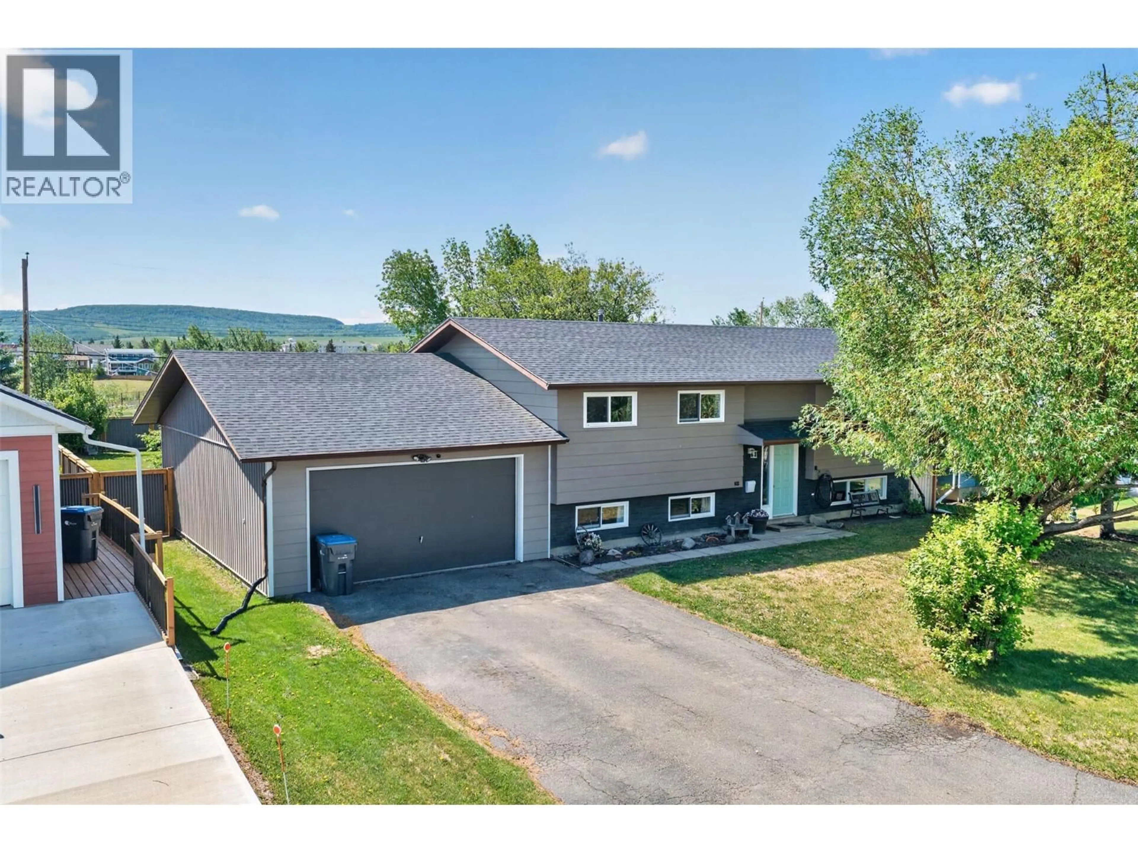 A pic from outside/outdoor area/front of a property/back of a property/a pic from drone, unknown for 1425 106 AVENUE, Dawson Creek British Columbia V1G2P4