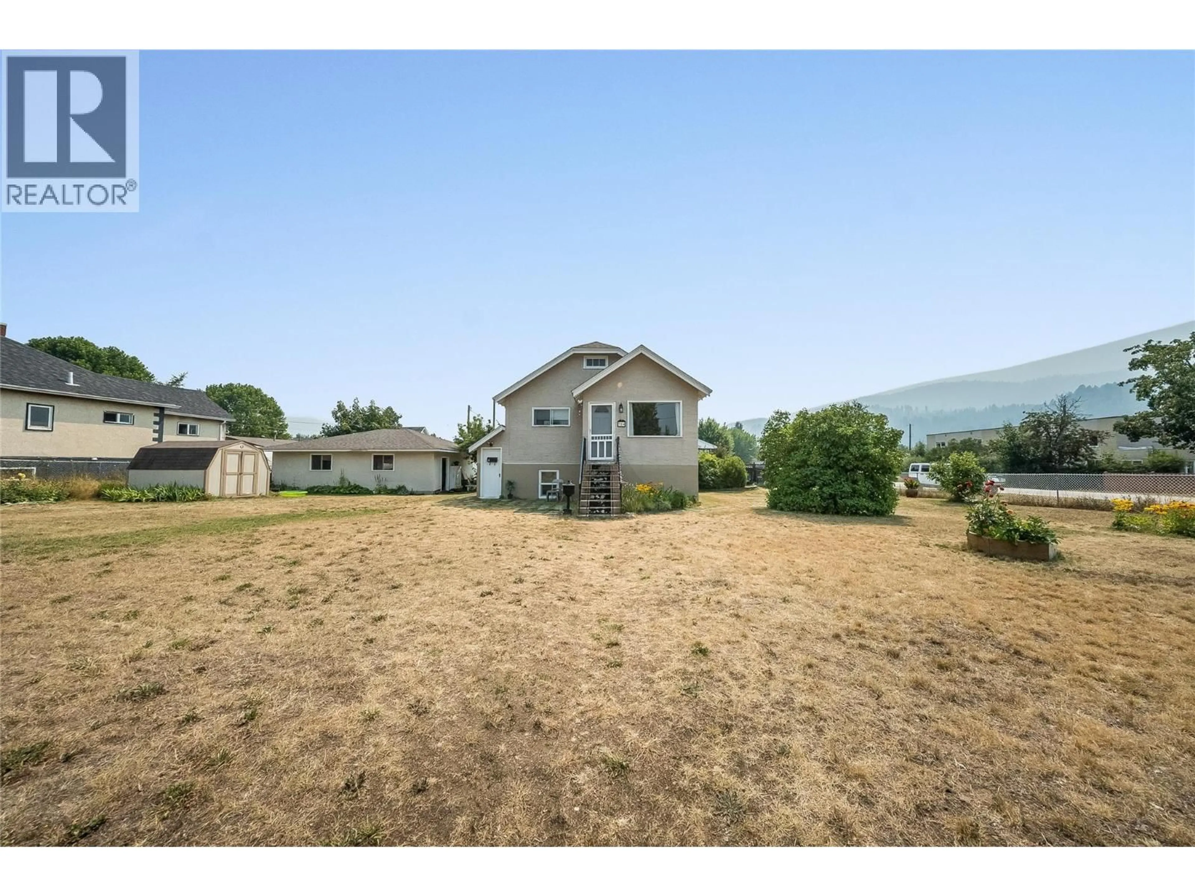 A pic from outside/outdoor area/front of a property/back of a property/a pic from drone, mountain view for 714 2ND STREET, Castlegar British Columbia V1N1Y8