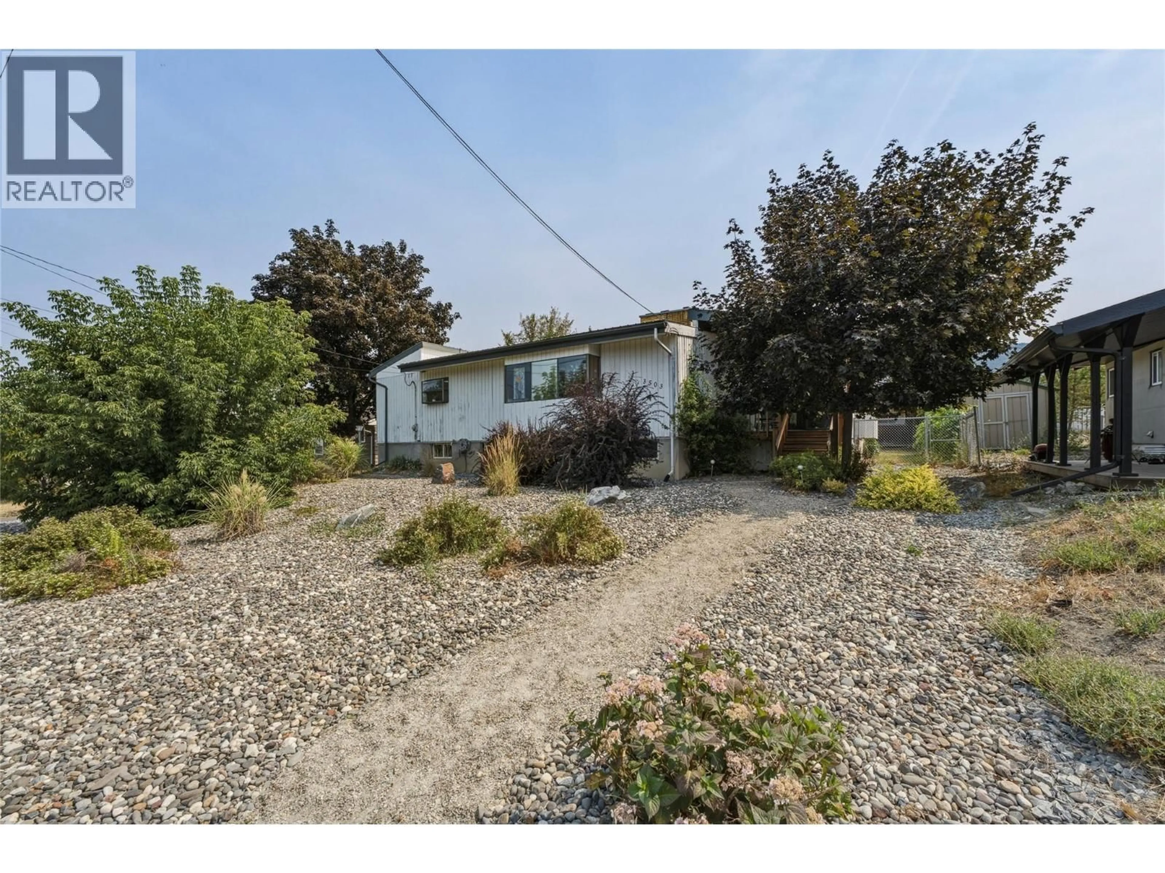A pic from outside/outdoor area/front of a property/back of a property/a pic from drone, street for 3503 19 STREET, Vernon British Columbia V1T4B8