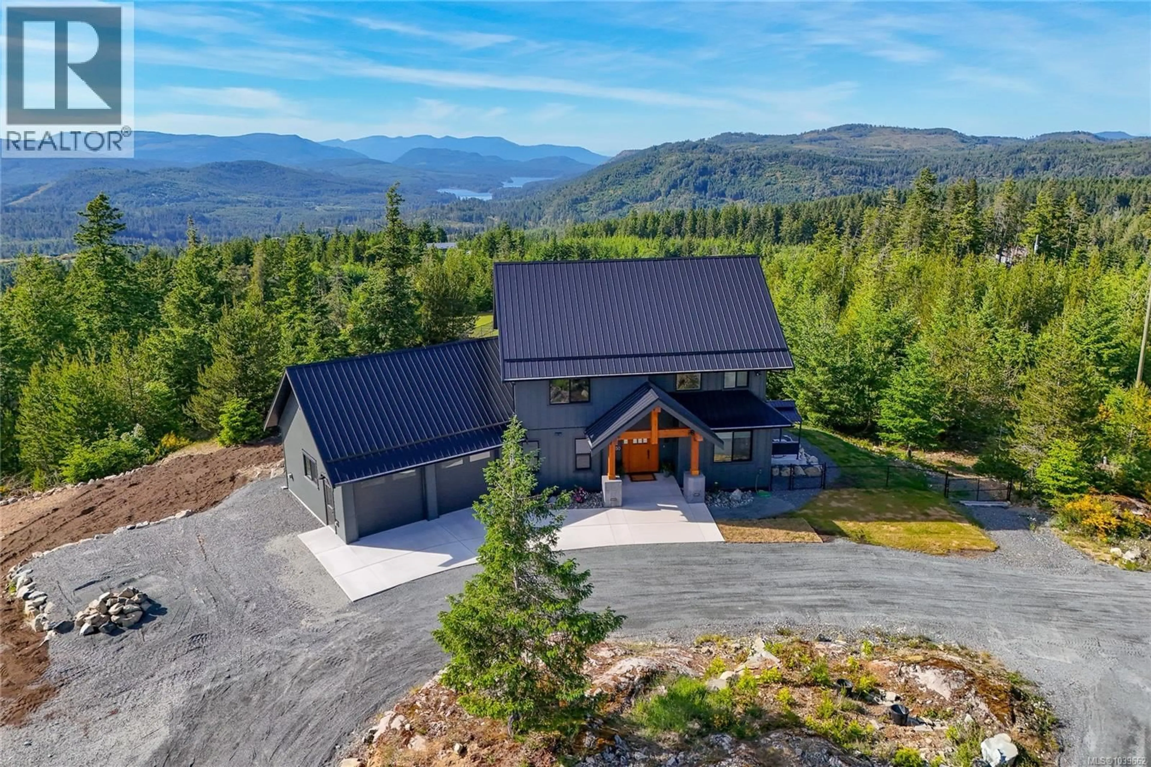 A pic from outside/outdoor area/front of a property/back of a property/a pic from drone, mountain view for 4650 GOLDSTREAM HEIGHTS DRIVE, Shawnigan Lake British Columbia V0R2W3