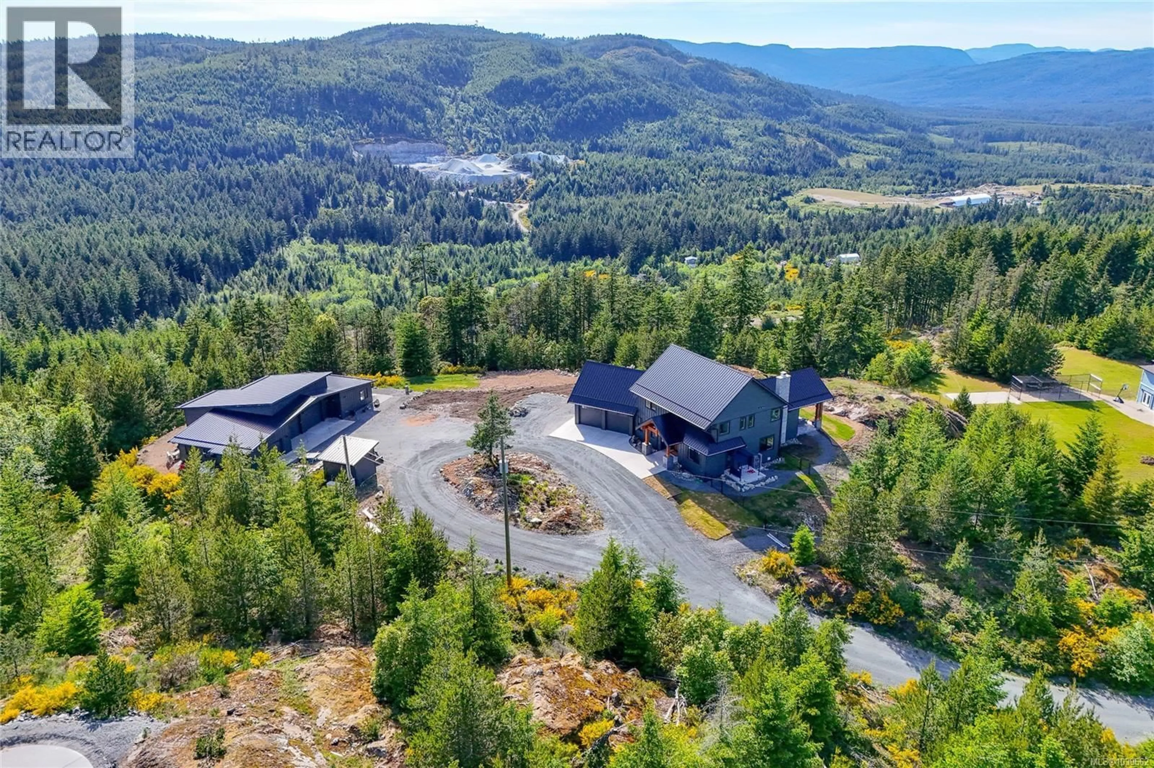 A pic from outside/outdoor area/front of a property/back of a property/a pic from drone, mountain view for 4650 GOLDSTREAM HEIGHTS DRIVE, Shawnigan Lake British Columbia V0R2W3