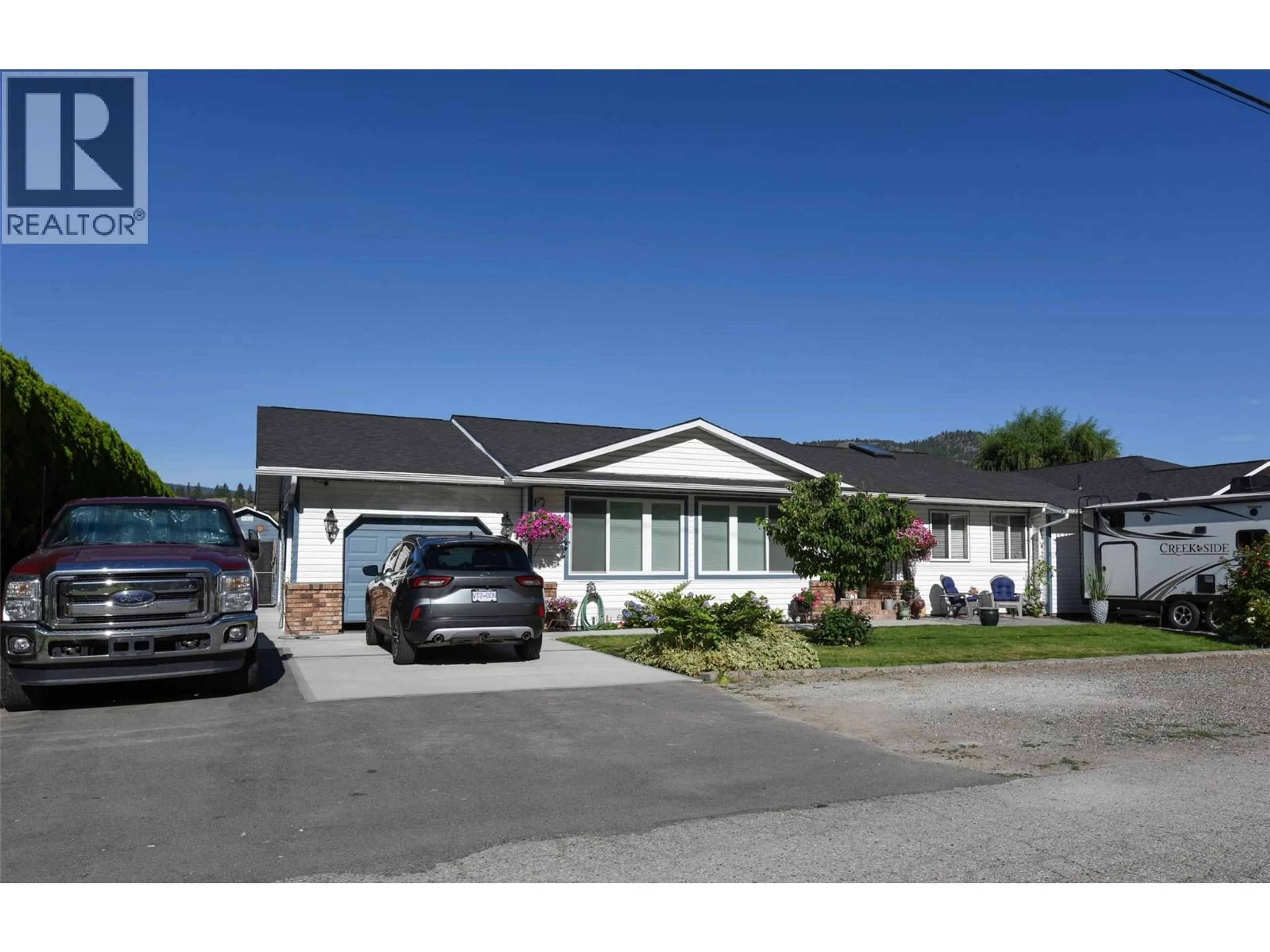 Home with vinyl exterior material, street for 11414 ADAMS AVENUE, Summerland British Columbia V0H1Z2