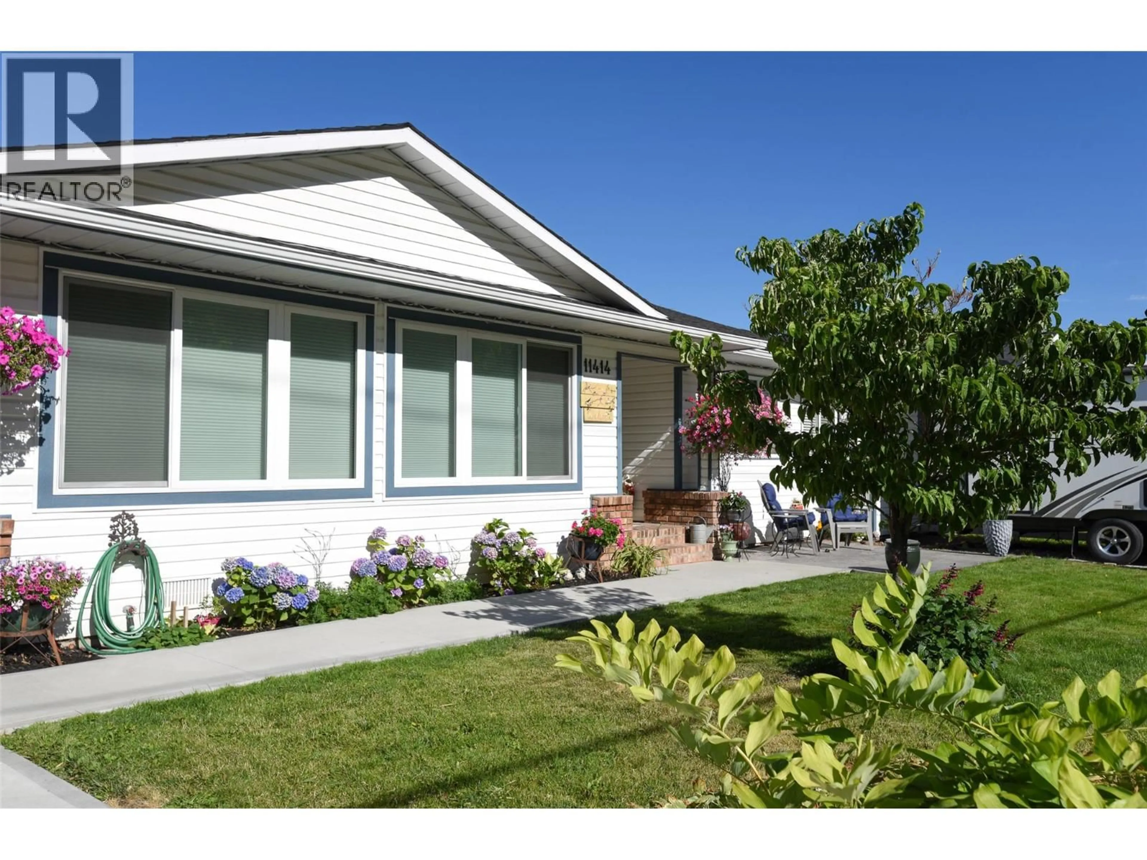 Home with vinyl exterior material, street for 11414 ADAMS AVENUE, Summerland British Columbia V0H1Z2
