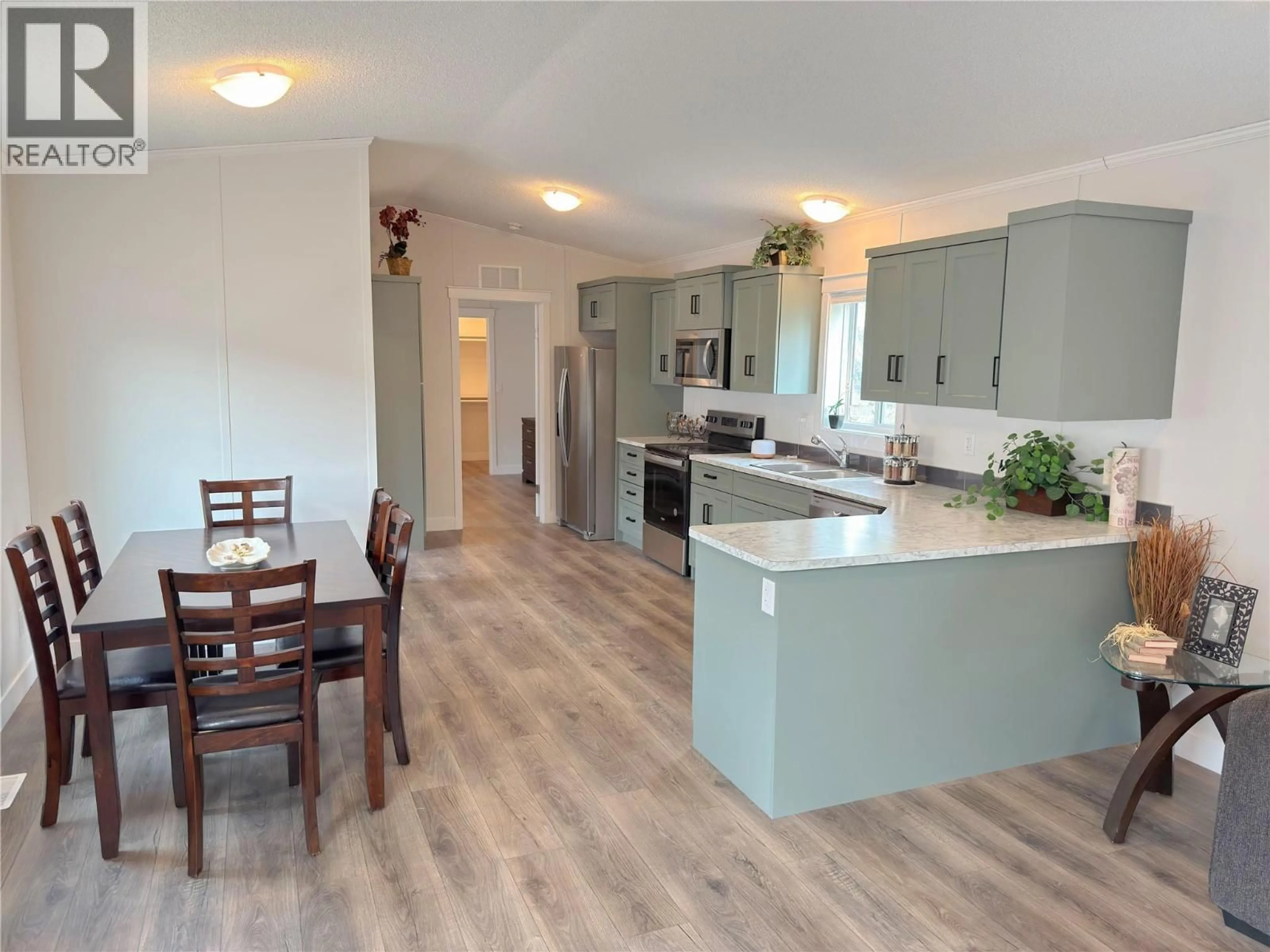 Open concept kitchen, wood/laminate floor for 13 - 473 CORINA AVENUE, Princeton British Columbia V0X1W0