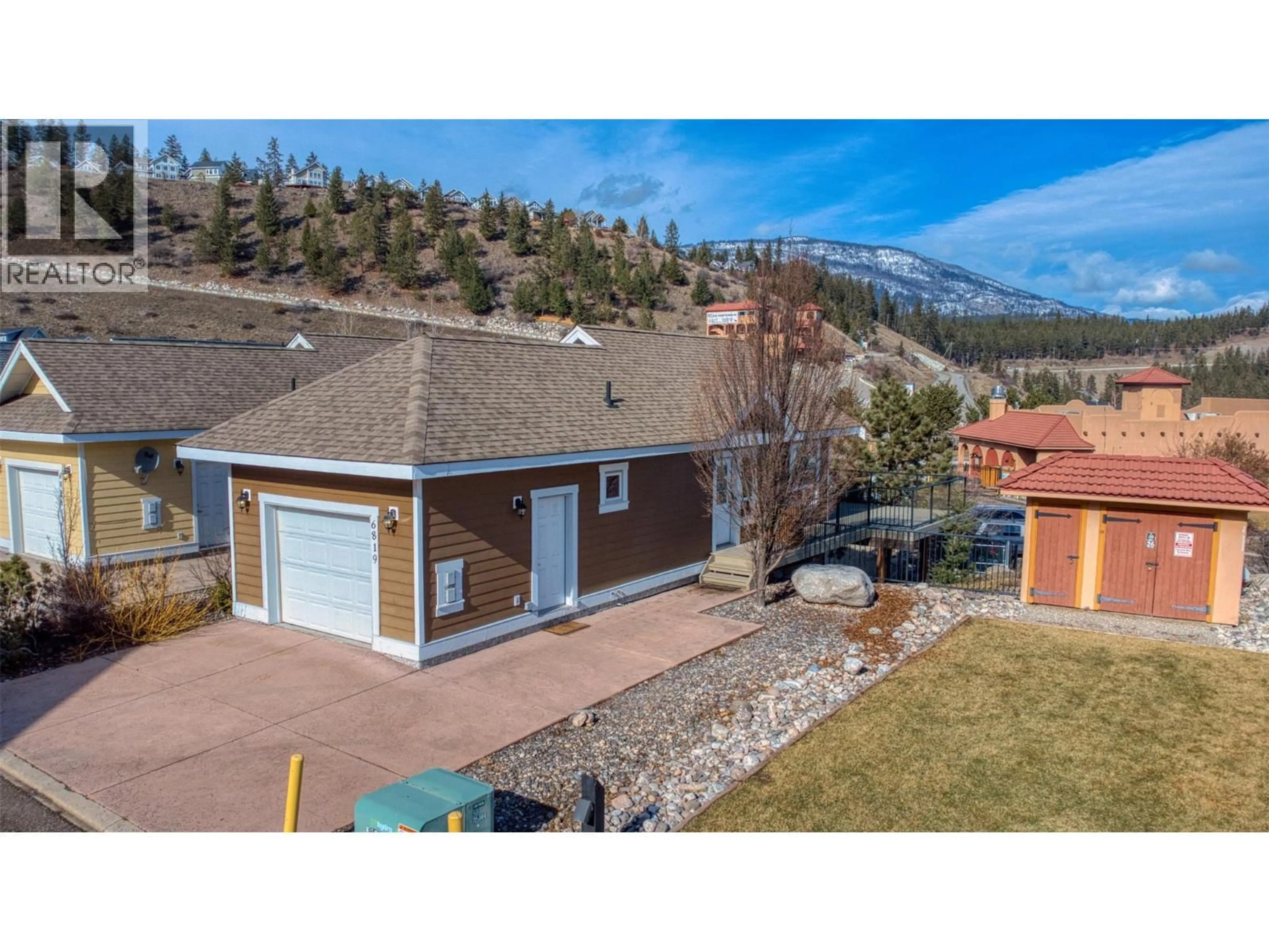 A pic from outside/outdoor area/front of a property/back of a property/a pic from drone, unknown for 355 - 6819 MADRID WAY, Kelowna British Columbia V1Z3R8