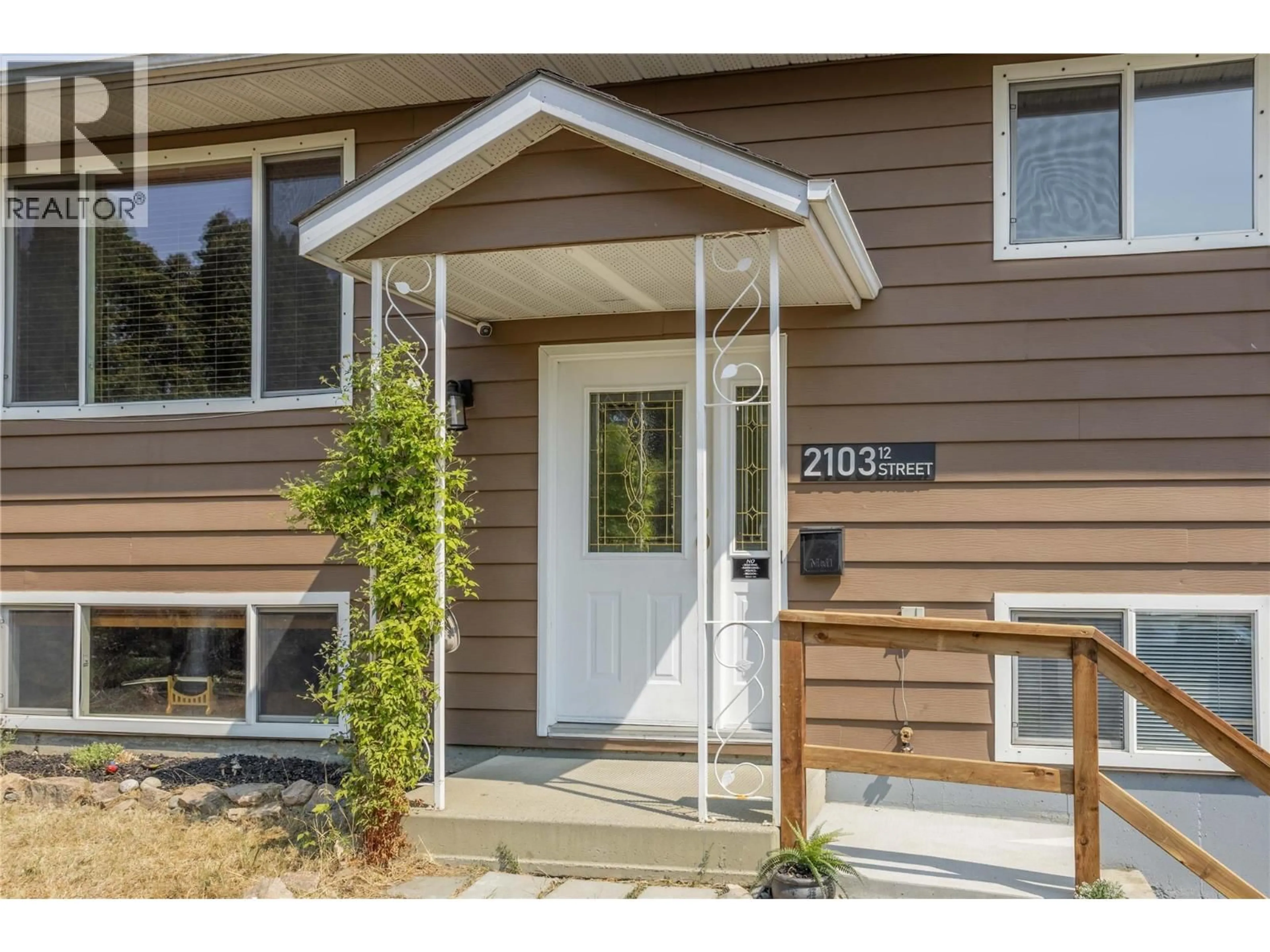 Home with vinyl exterior material, street for 2103 12 STREET, Vernon British Columbia V1T3S5