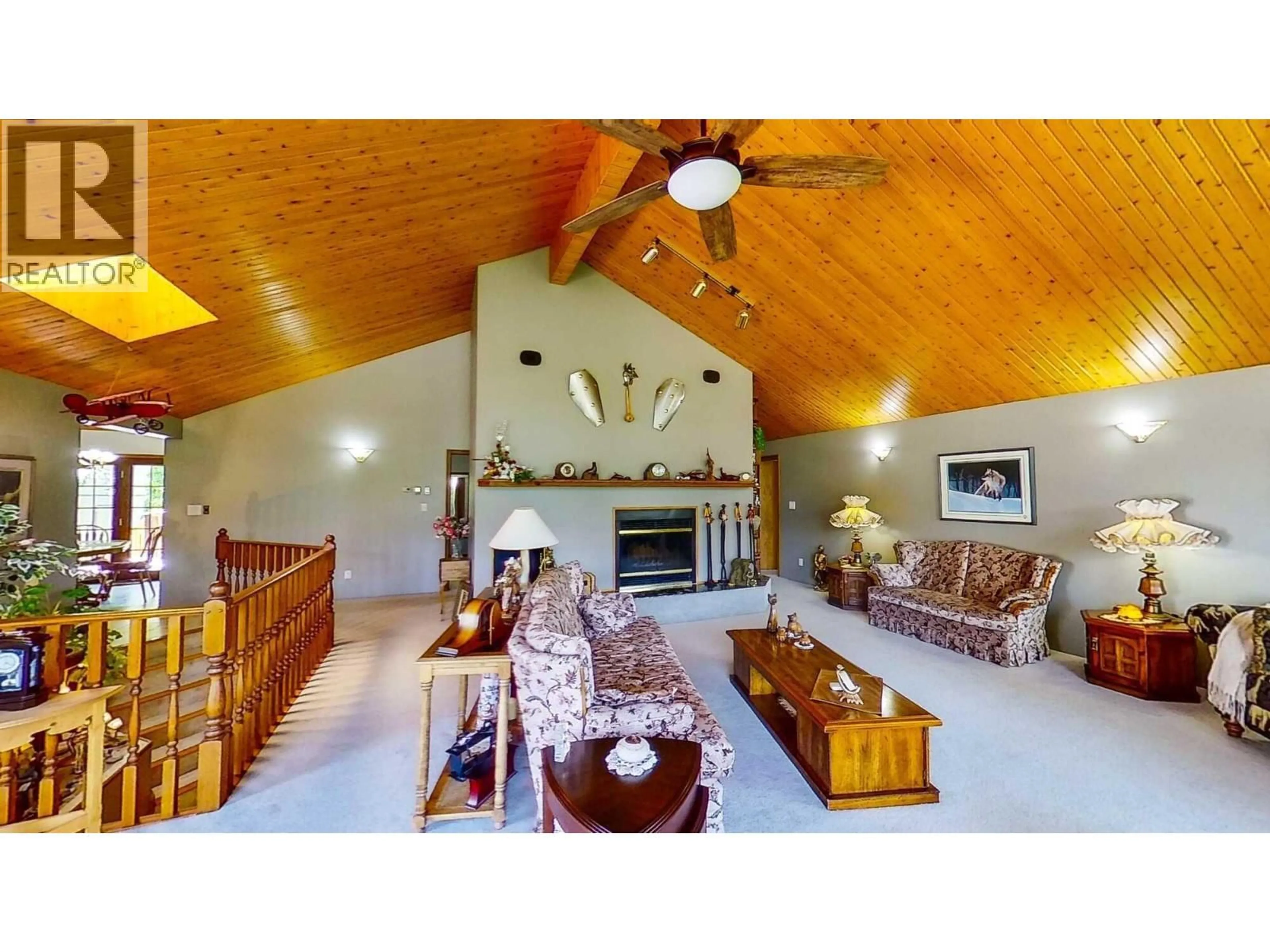 Living room with furniture, wood/laminate floor for 8408 RICHARDSON CRESCENT, Canal Flats British Columbia V0B1B0