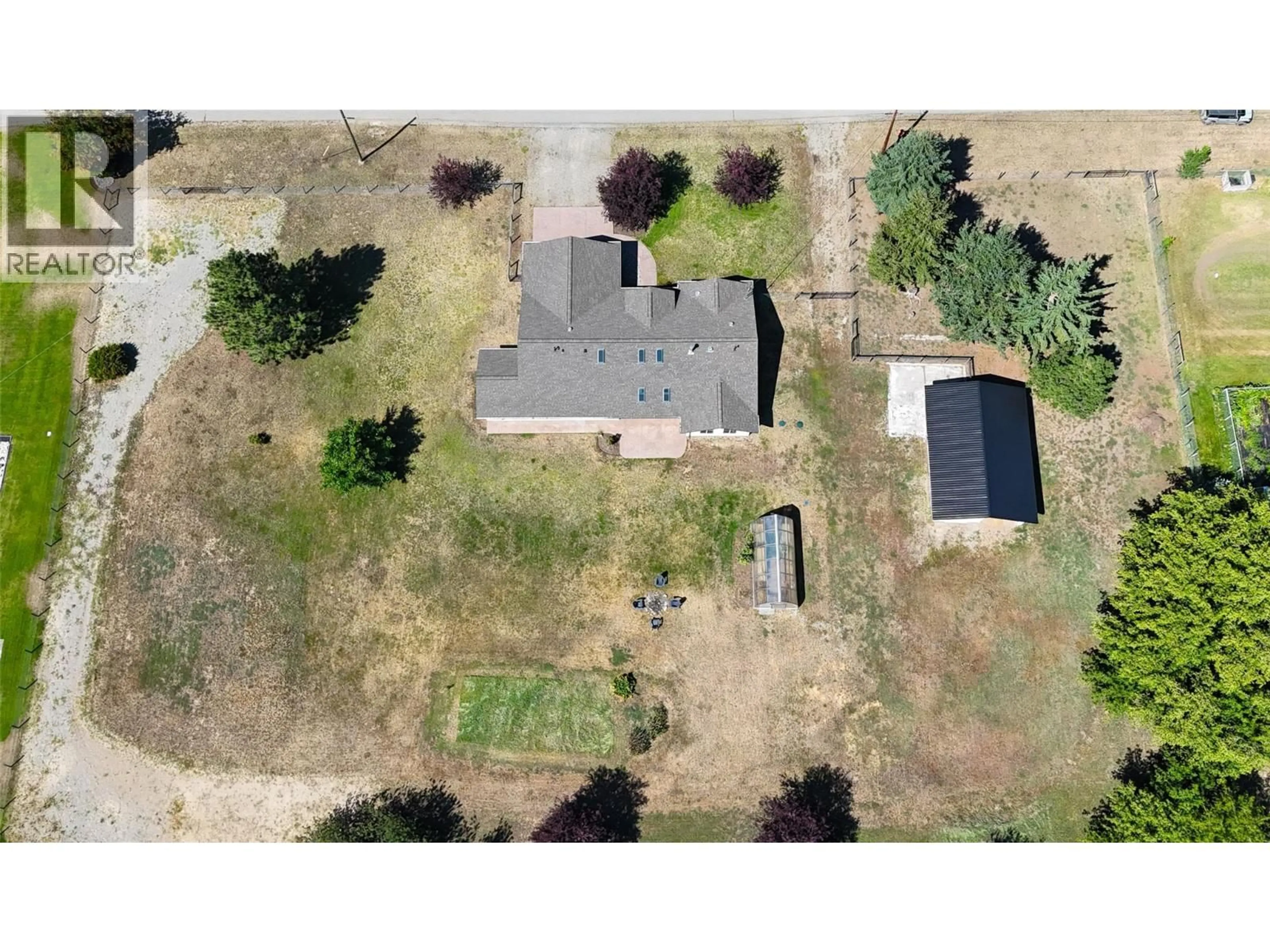 A pic from outside/outdoor area/front of a property/back of a property/a pic from drone, street for 8170 PLOTNIKOFF ROAD, Grand Forks British Columbia V0H1H2