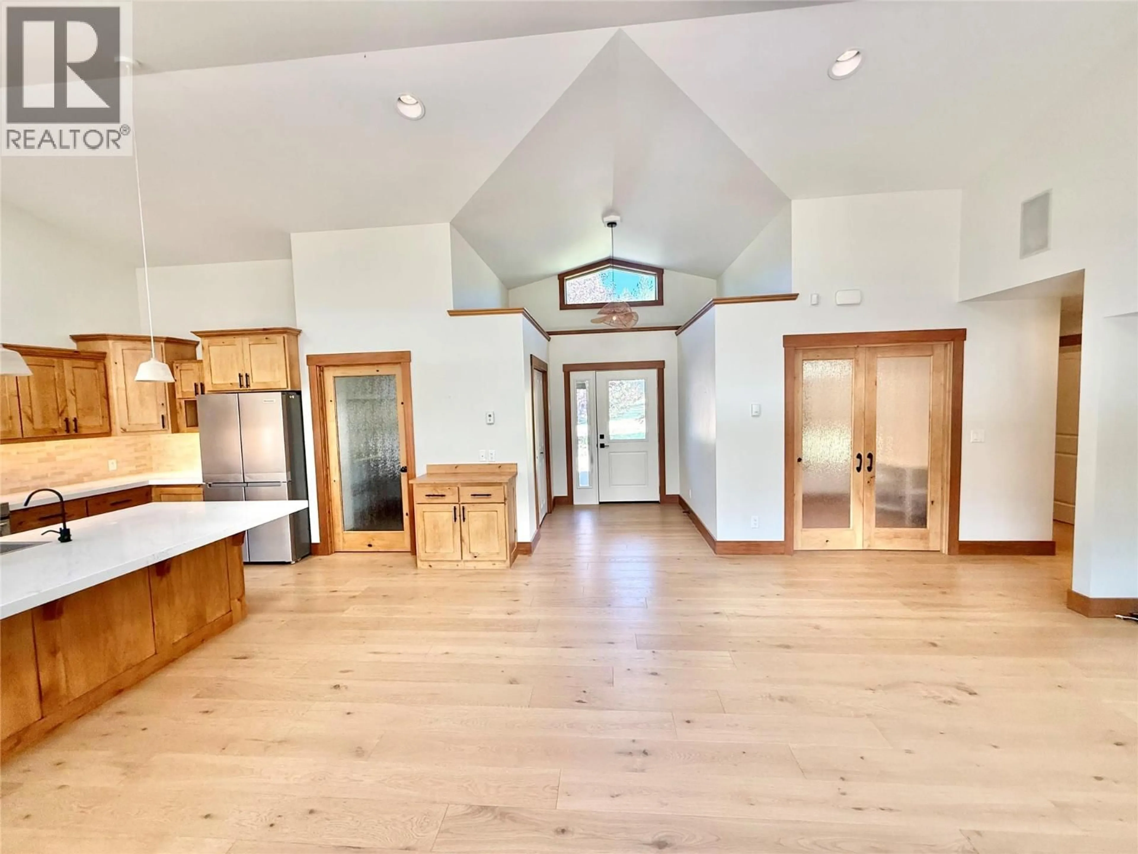 Open concept kitchen, wood/laminate floor for 8170 PLOTNIKOFF ROAD, Grand Forks British Columbia V0H1H2