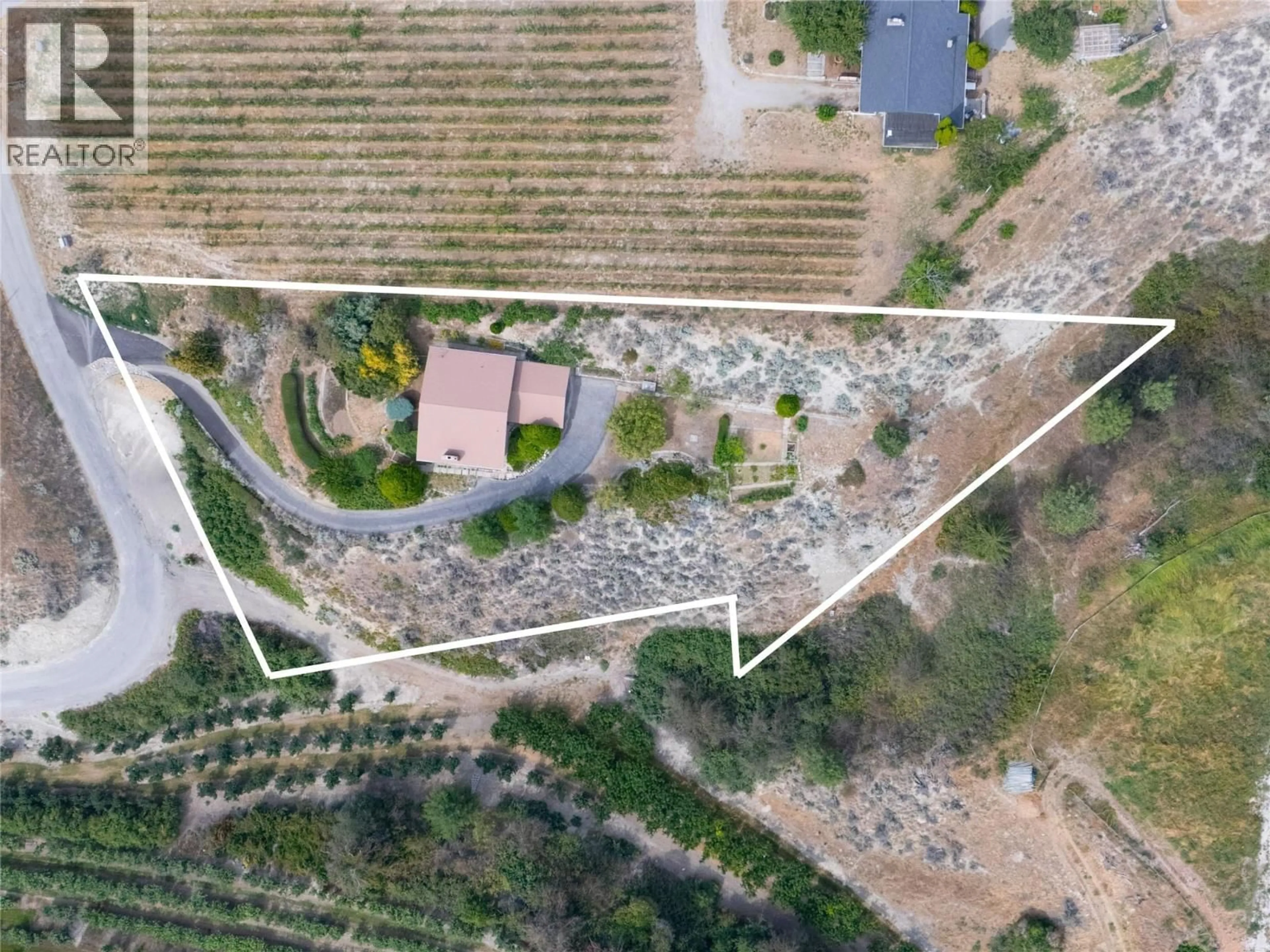 A pic from outside/outdoor area/front of a property/back of a property/a pic from drone, street for 4310 GULCH ROAD, Naramata British Columbia V0H1N0