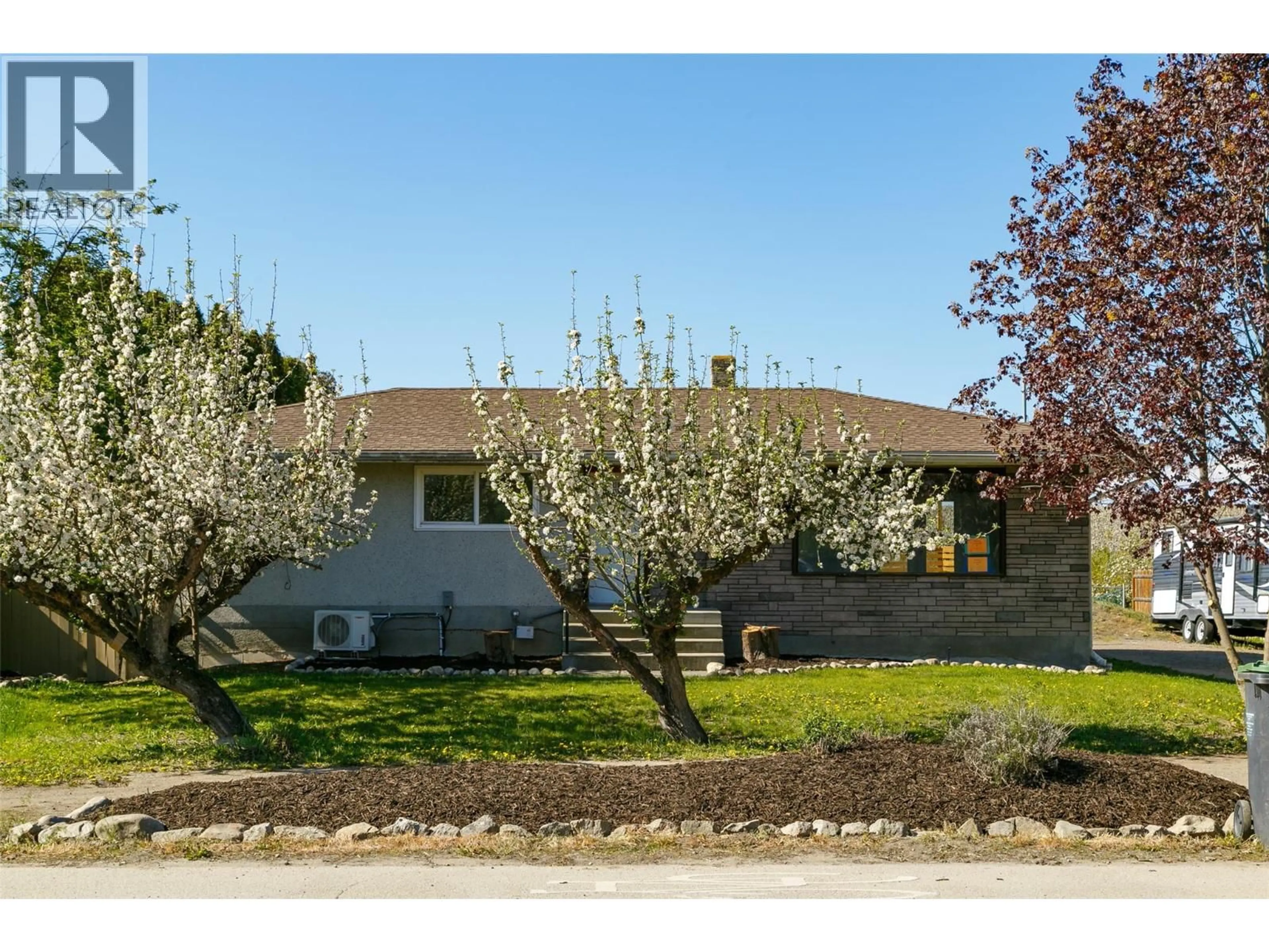 Home with vinyl exterior material, street for 2451 SEXSMITH ROAD, Kelowna British Columbia V1V2E9