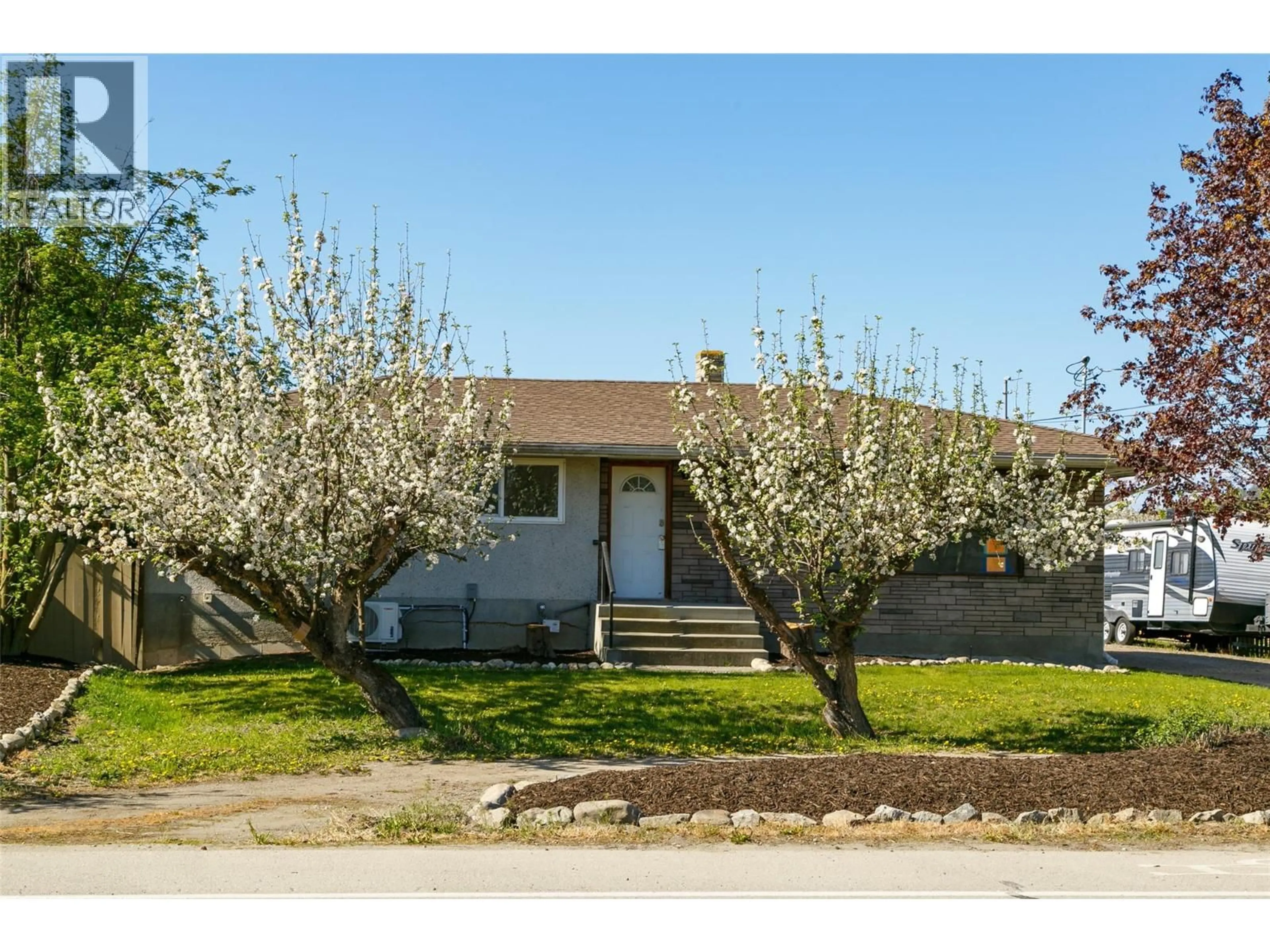 Home with vinyl exterior material, street for 2451 SEXSMITH ROAD, Kelowna British Columbia V1V2E9