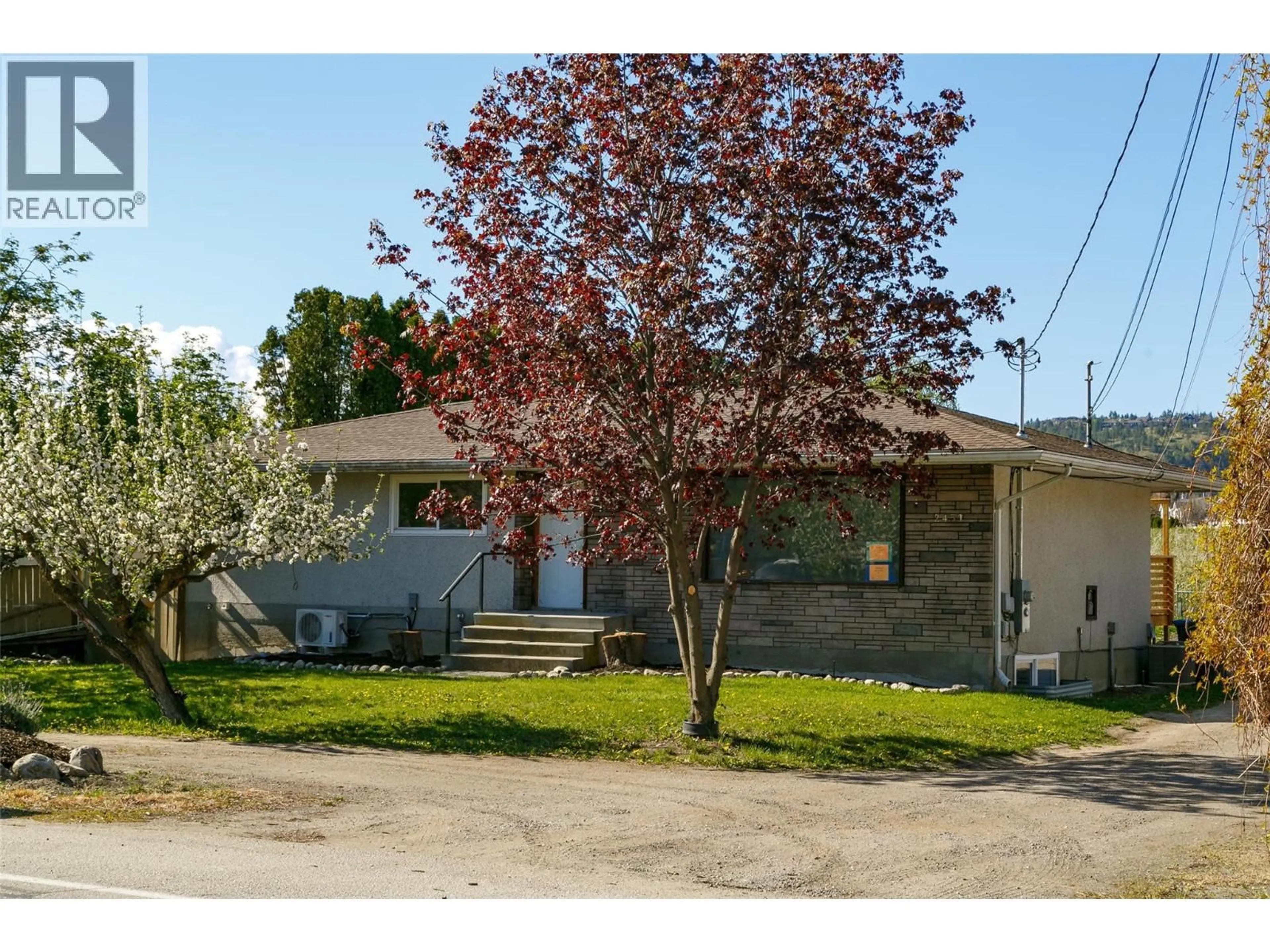 A pic from outside/outdoor area/front of a property/back of a property/a pic from drone, street for 2451 SEXSMITH ROAD, Kelowna British Columbia V1V2E9