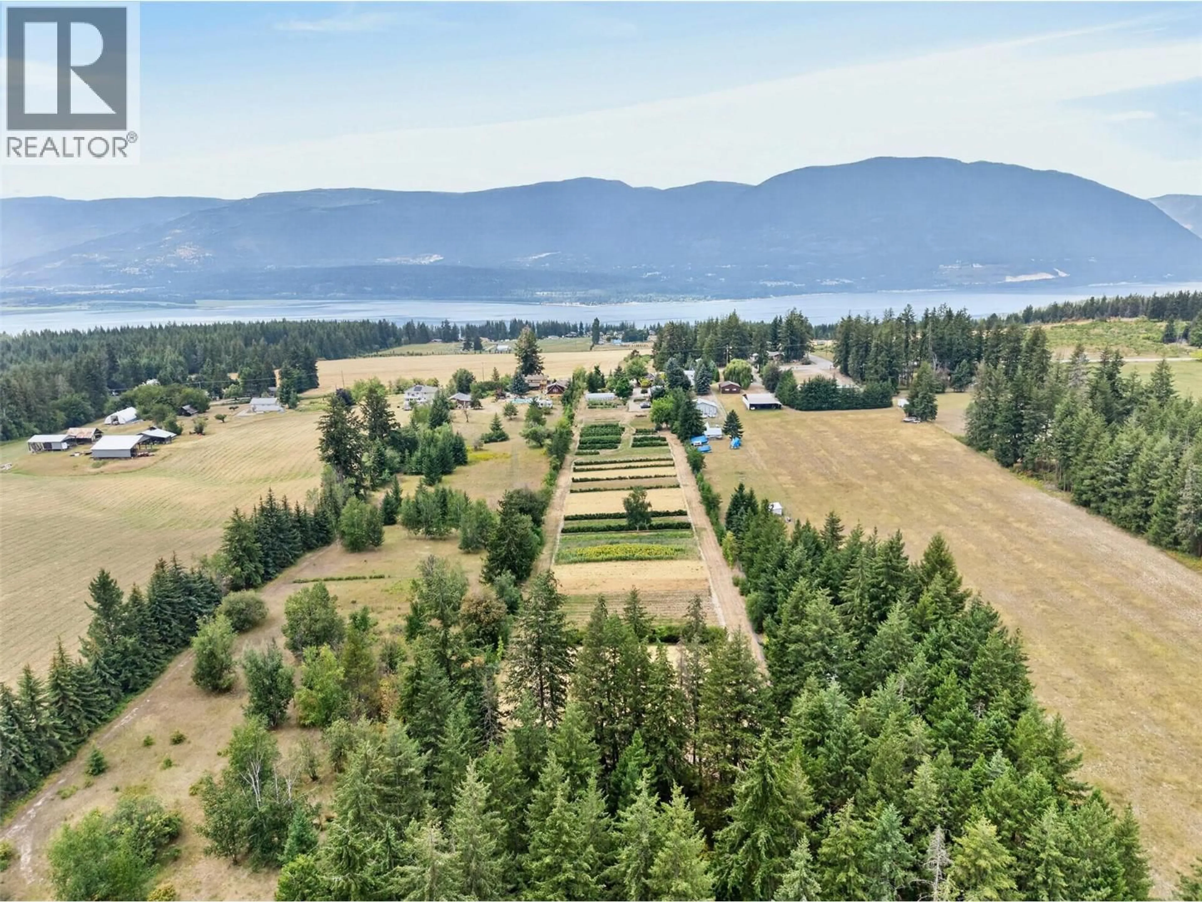 A pic from outside/outdoor area/front of a property/back of a property/a pic from drone, water/lake/river/ocean view for 4360 30 STREET NORTHEAST, Salmon Arm British Columbia V1E2A3