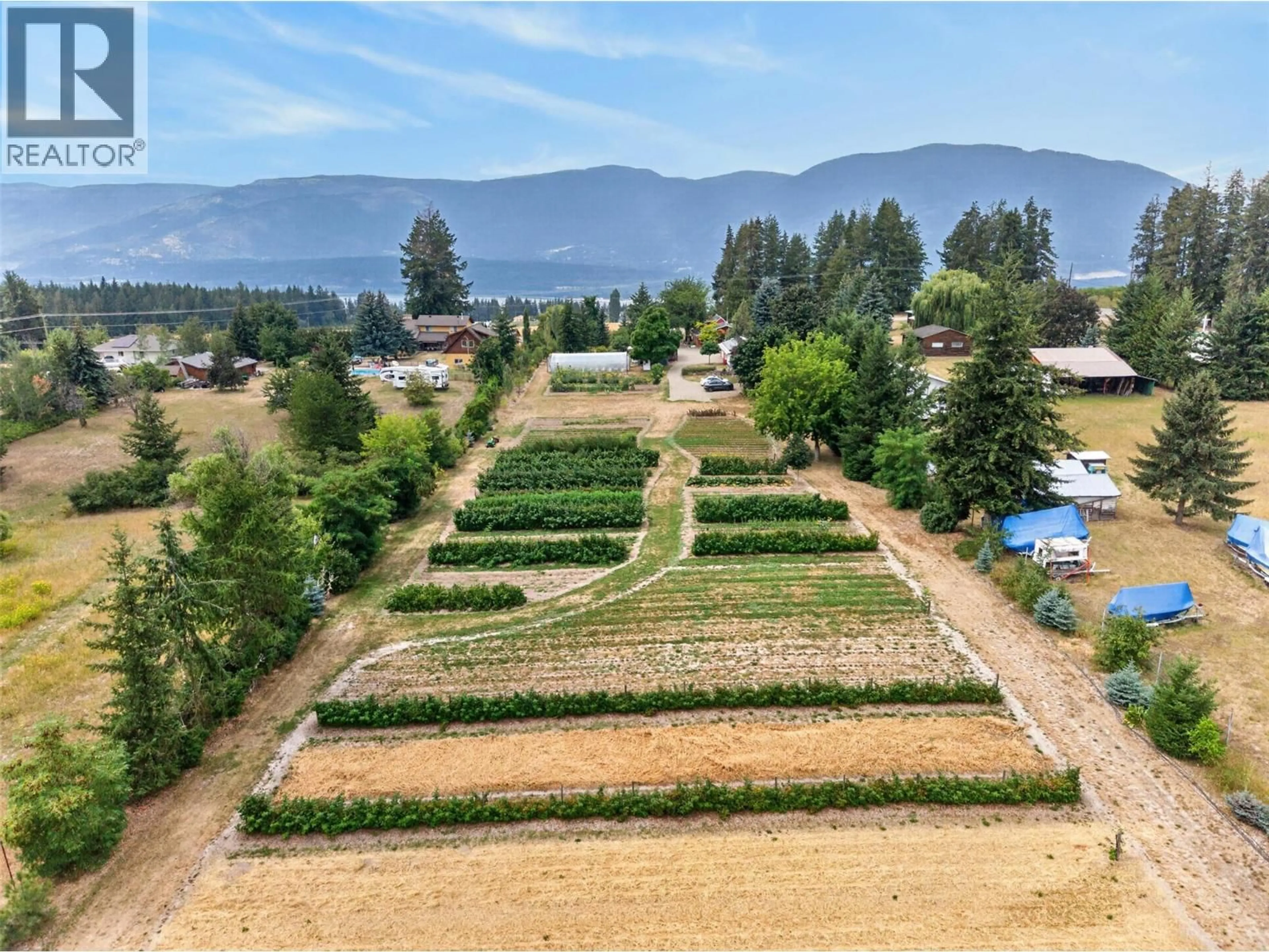 A pic from outside/outdoor area/front of a property/back of a property/a pic from drone, mountain view for 4360 30 STREET NORTHEAST, Salmon Arm British Columbia V1E2A3