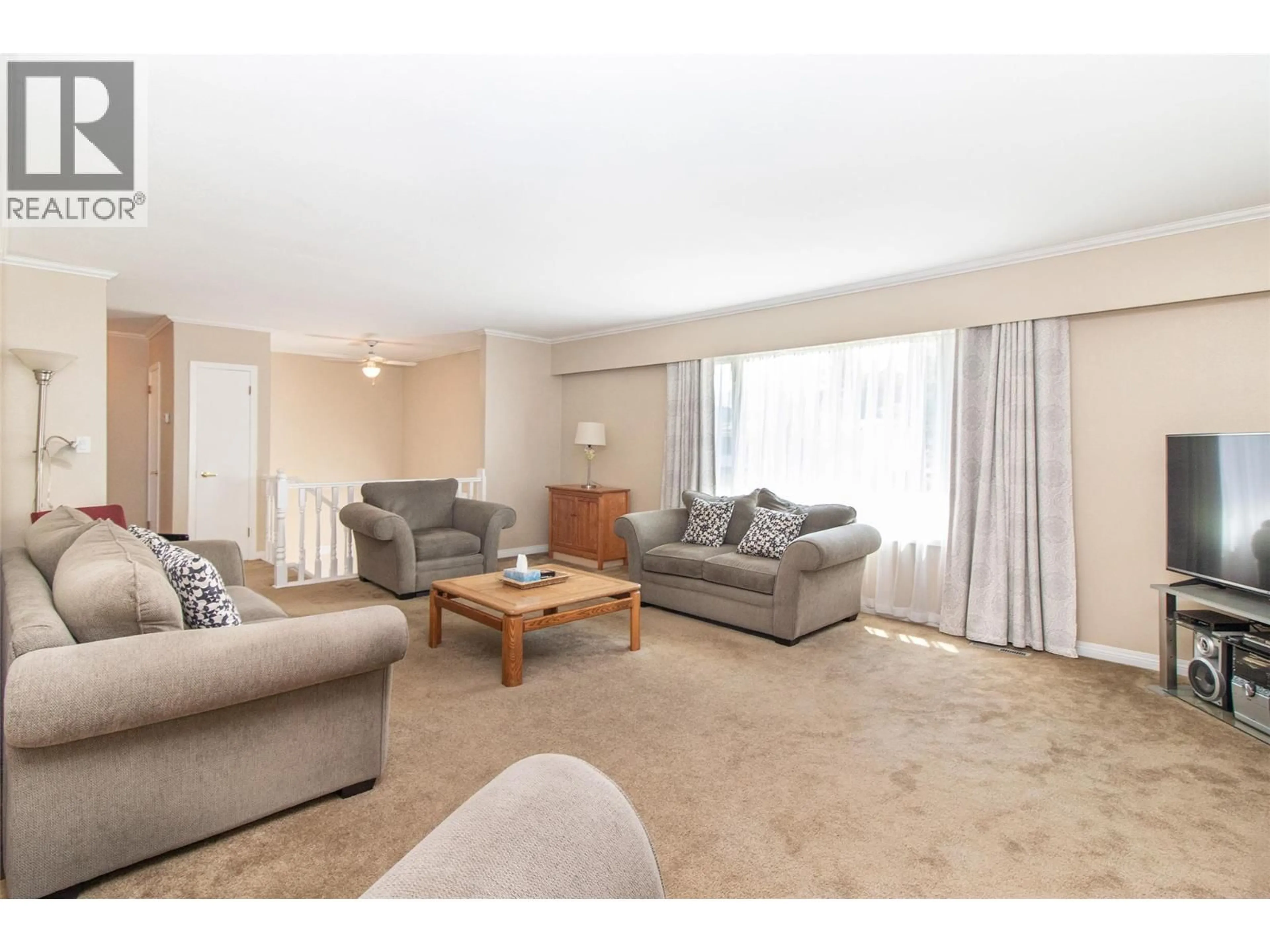Living room with furniture, carpet floor for 210 WALLACE ROAD, Kelowna British Columbia V1X4T1