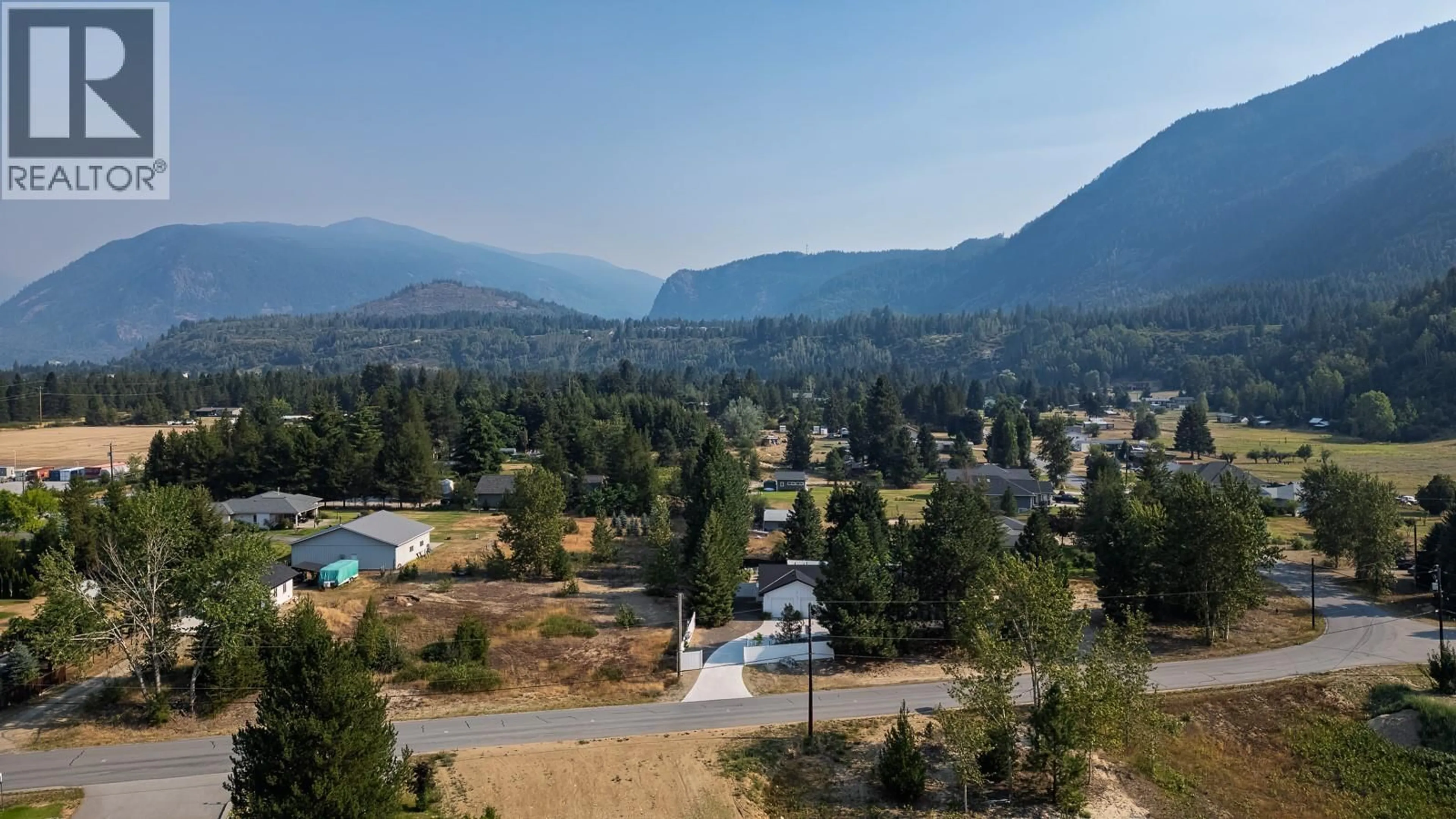 A pic from outside/outdoor area/front of a property/back of a property/a pic from drone, mountain view for 1217 MCPHEE ROAD, Castlegar British Columbia V1N4L8