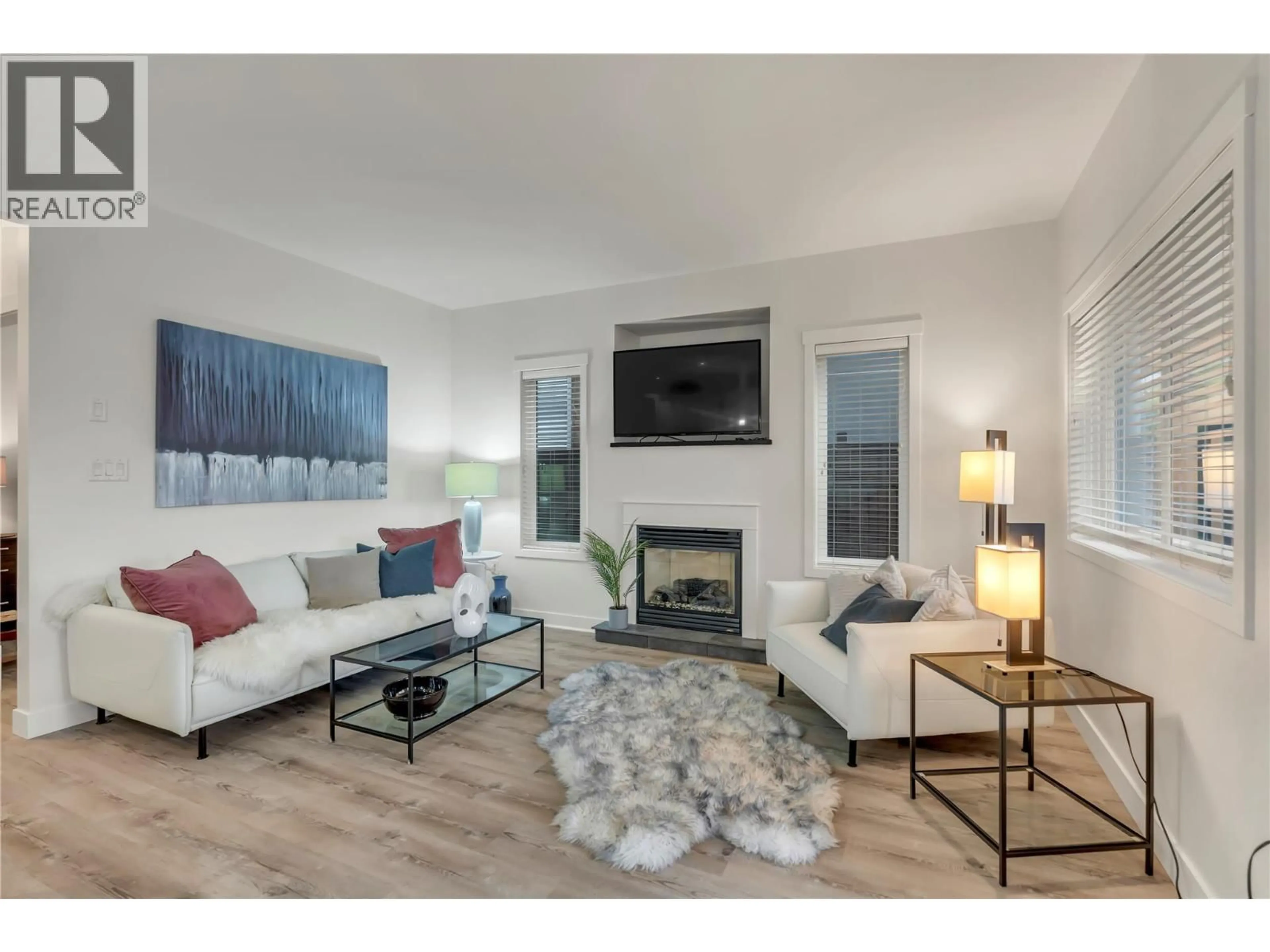 Living room with furniture, wood/laminate floor for 101 - 442 ALEXANDER AVENUE, Penticton British Columbia V2A1E5
