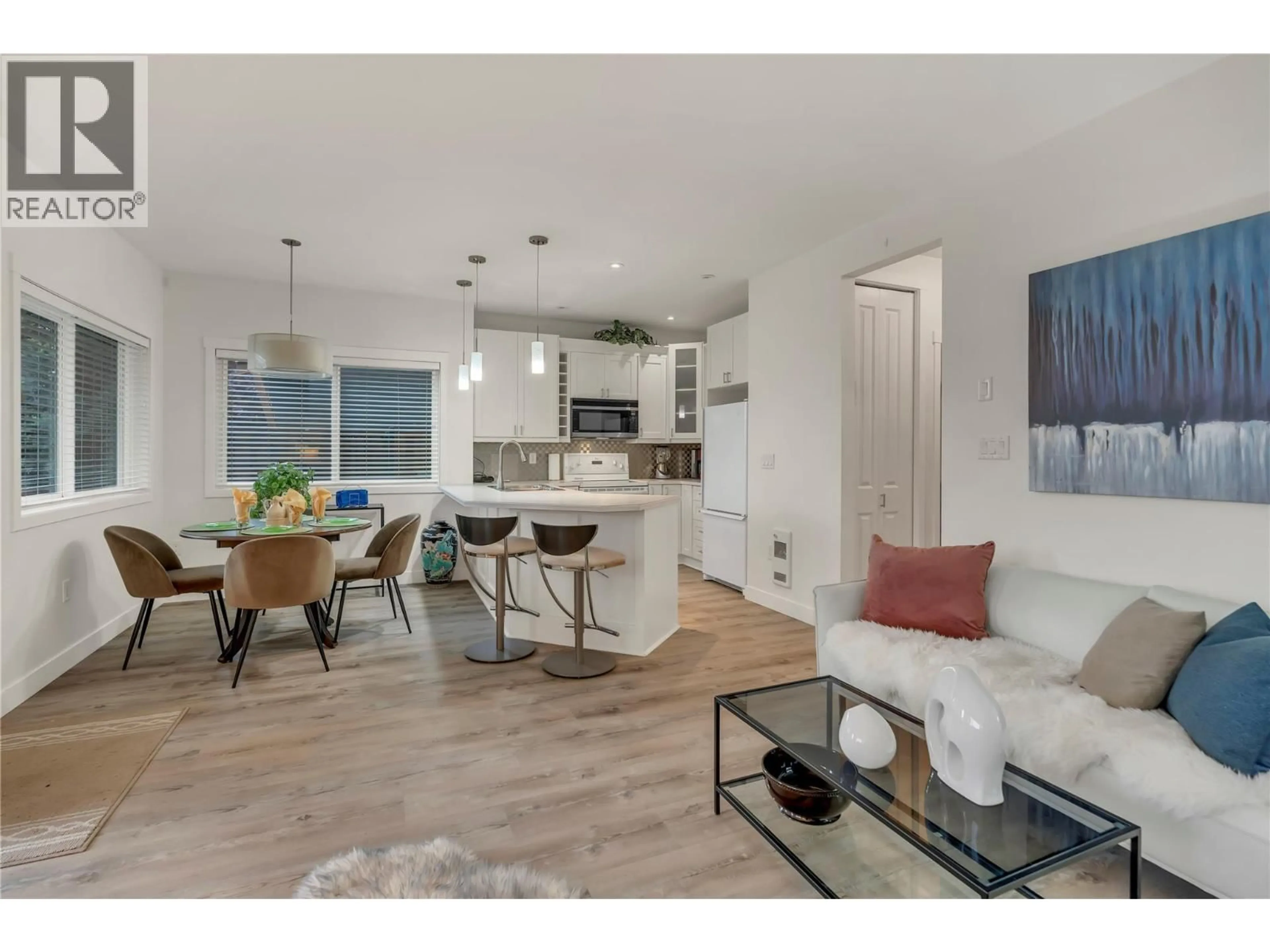 Open concept kitchen, wood/laminate floor for 101 - 442 ALEXANDER AVENUE, Penticton British Columbia V2A1E5