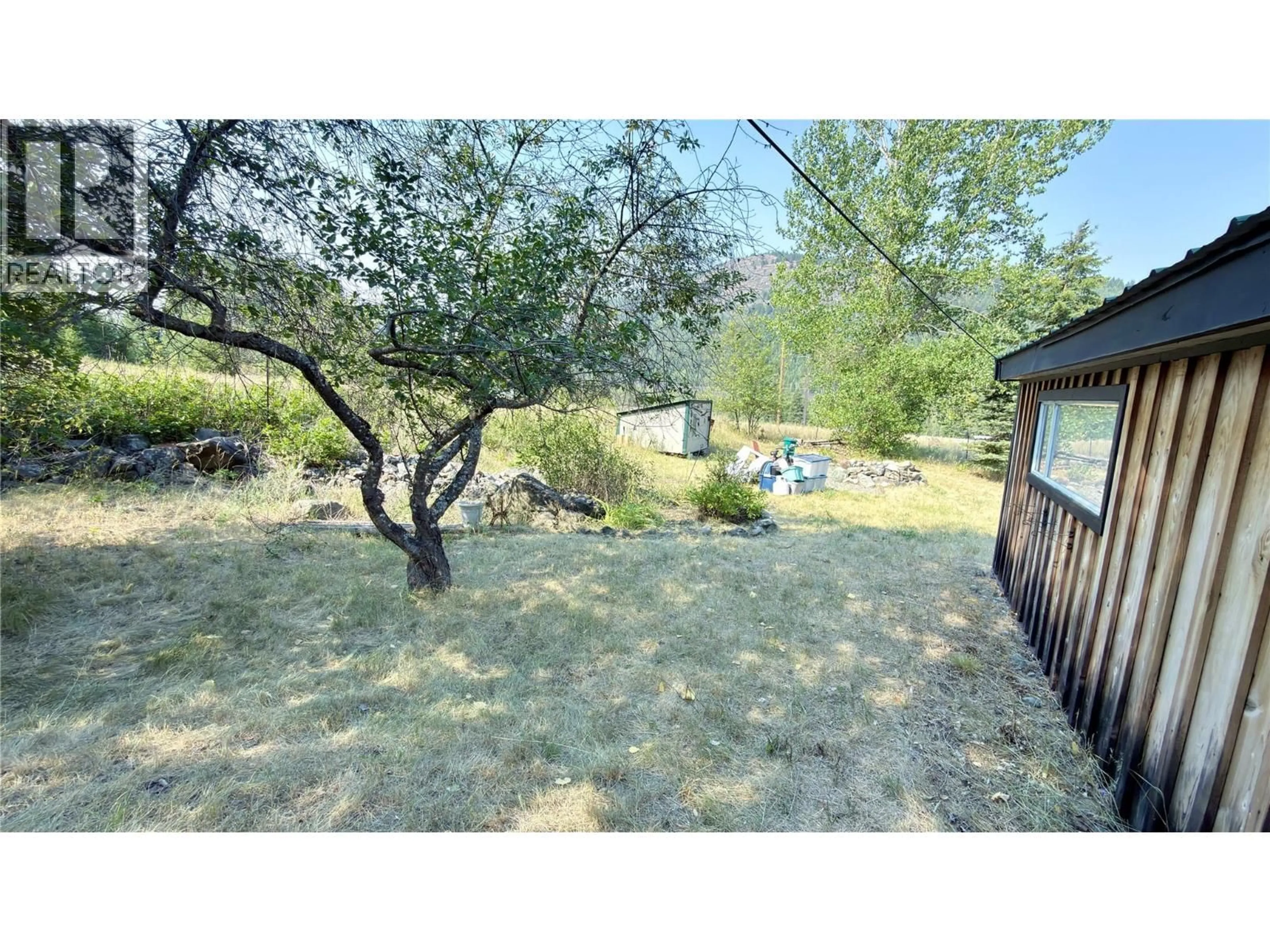A pic from outside/outdoor area/front of a property/back of a property/a pic from drone, forest/trees view for 425 EVERETTE AVENUE, Greenwood British Columbia V0H1J0