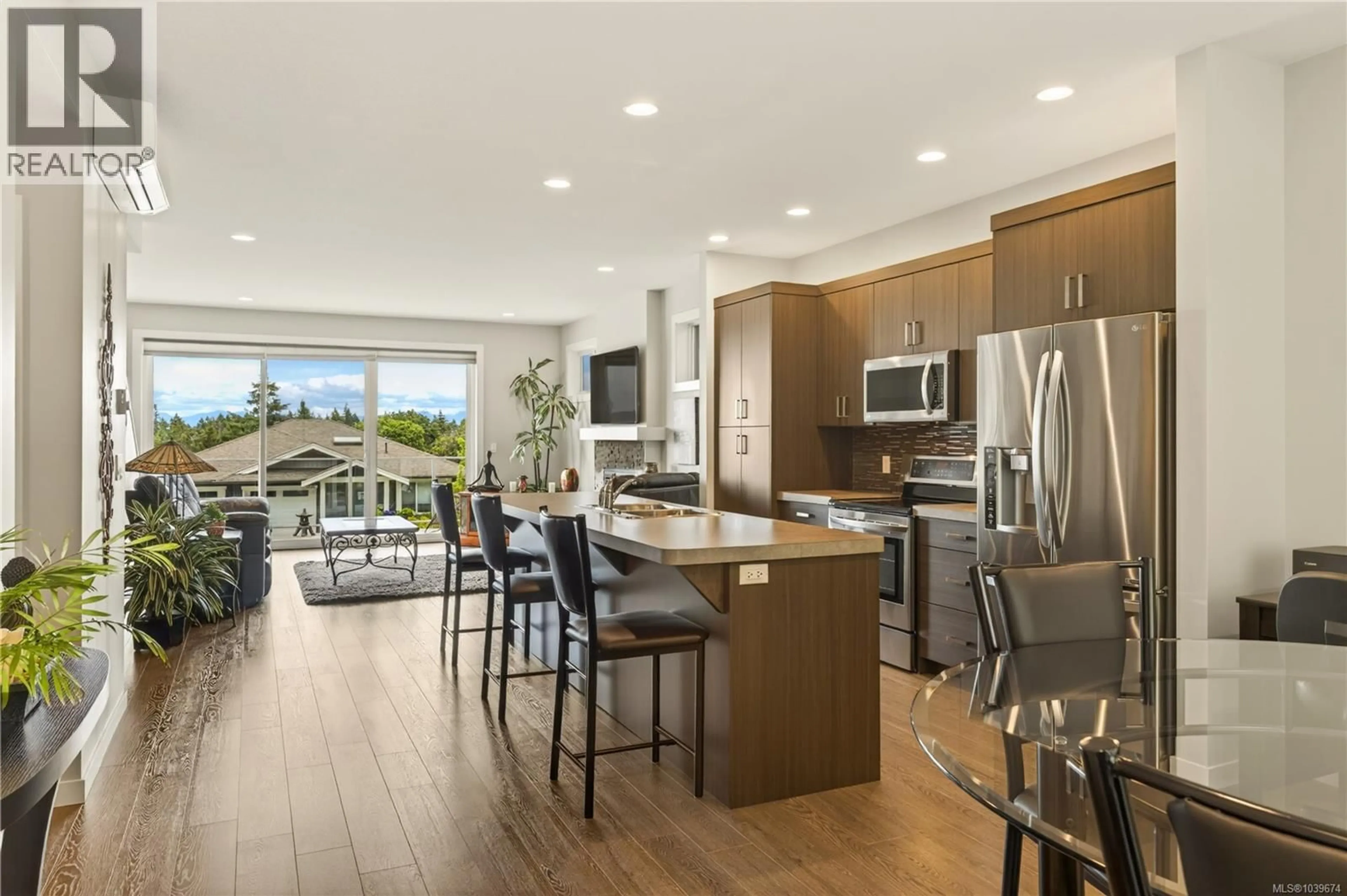 Open concept kitchen, wood/laminate floor for 5118 DUNN PLACE, Nanaimo British Columbia V9T0J2