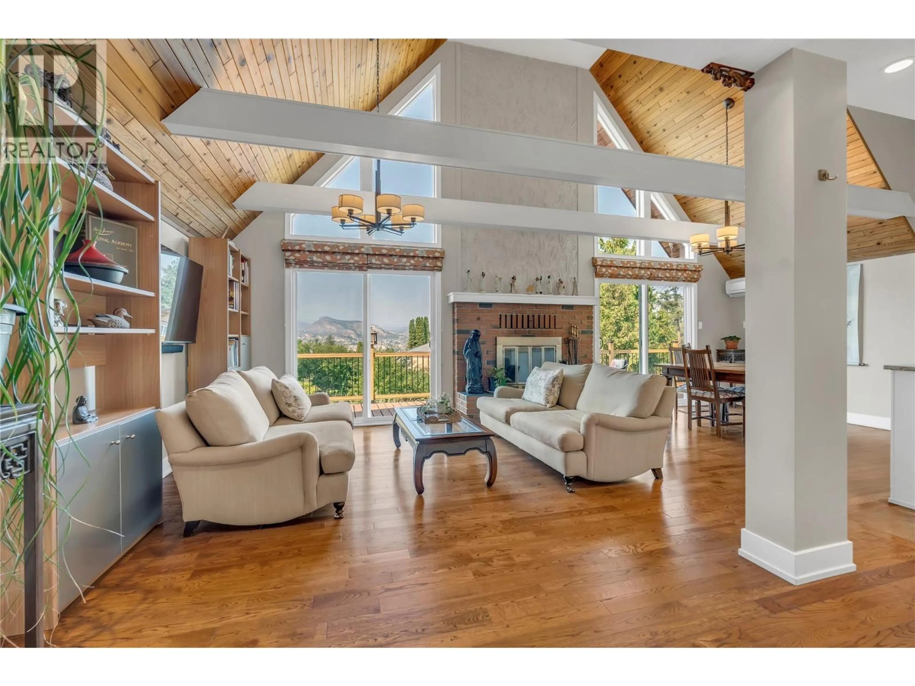 Living room with furniture, wood/laminate floor for 3015 PONDEROSA DRIVE, Naramata British Columbia V0H1N1