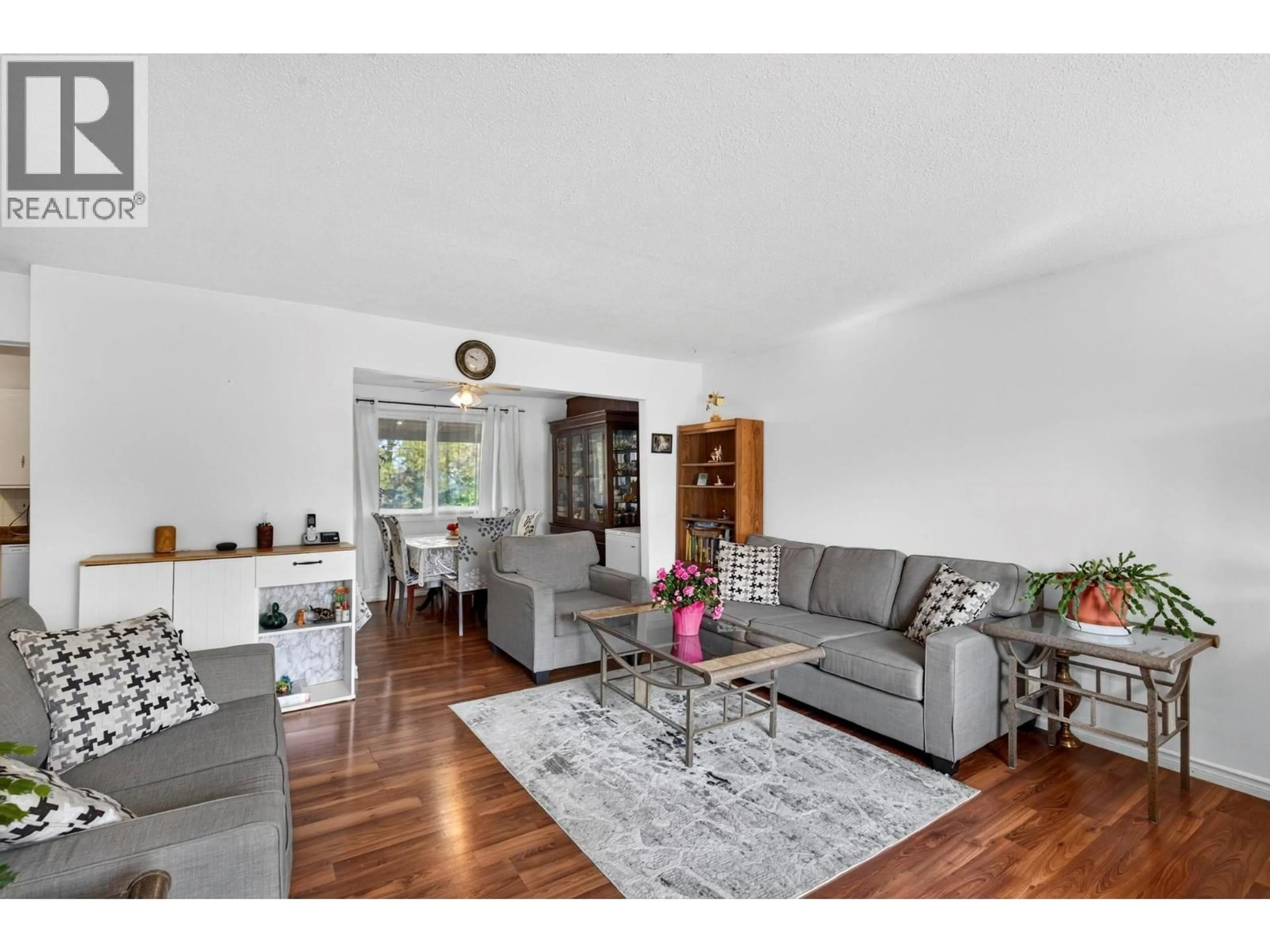 Living room with furniture, wood/laminate floor for 1904 22ND STREET, Vernon British Columbia V1T7G2