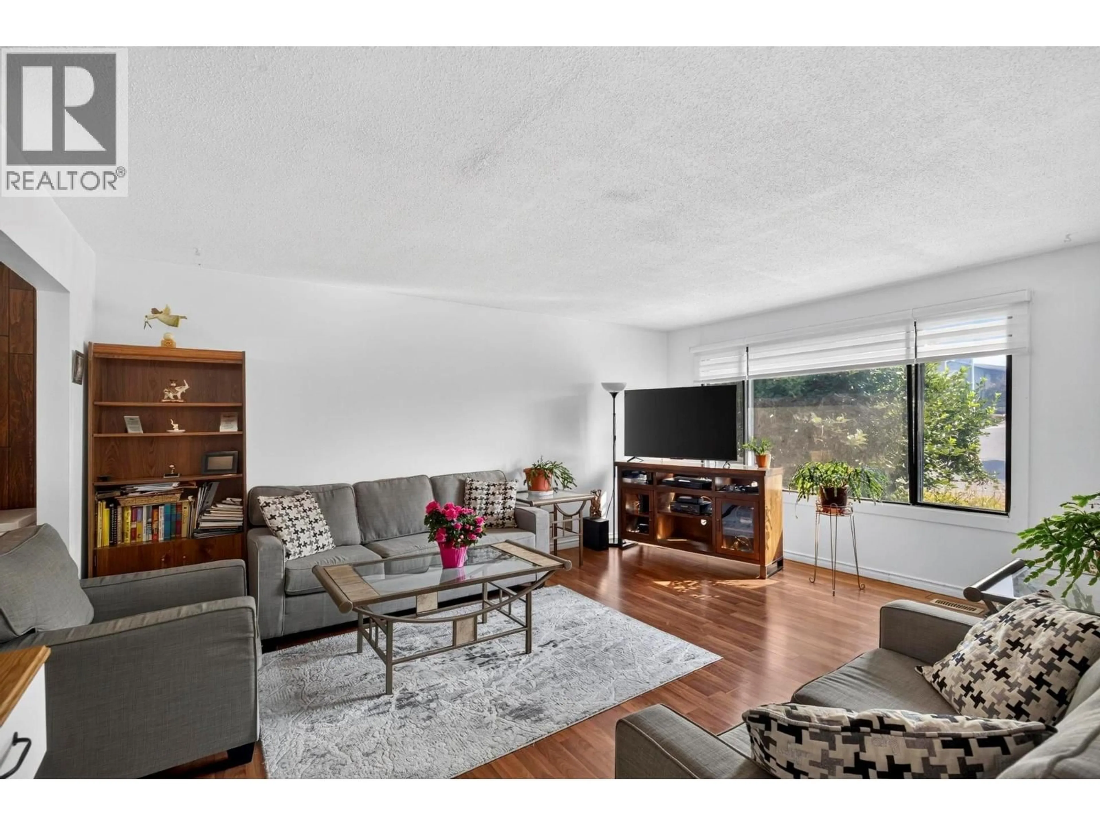 Living room with furniture, wood/laminate floor for 1904 22ND STREET, Vernon British Columbia V1T7G2