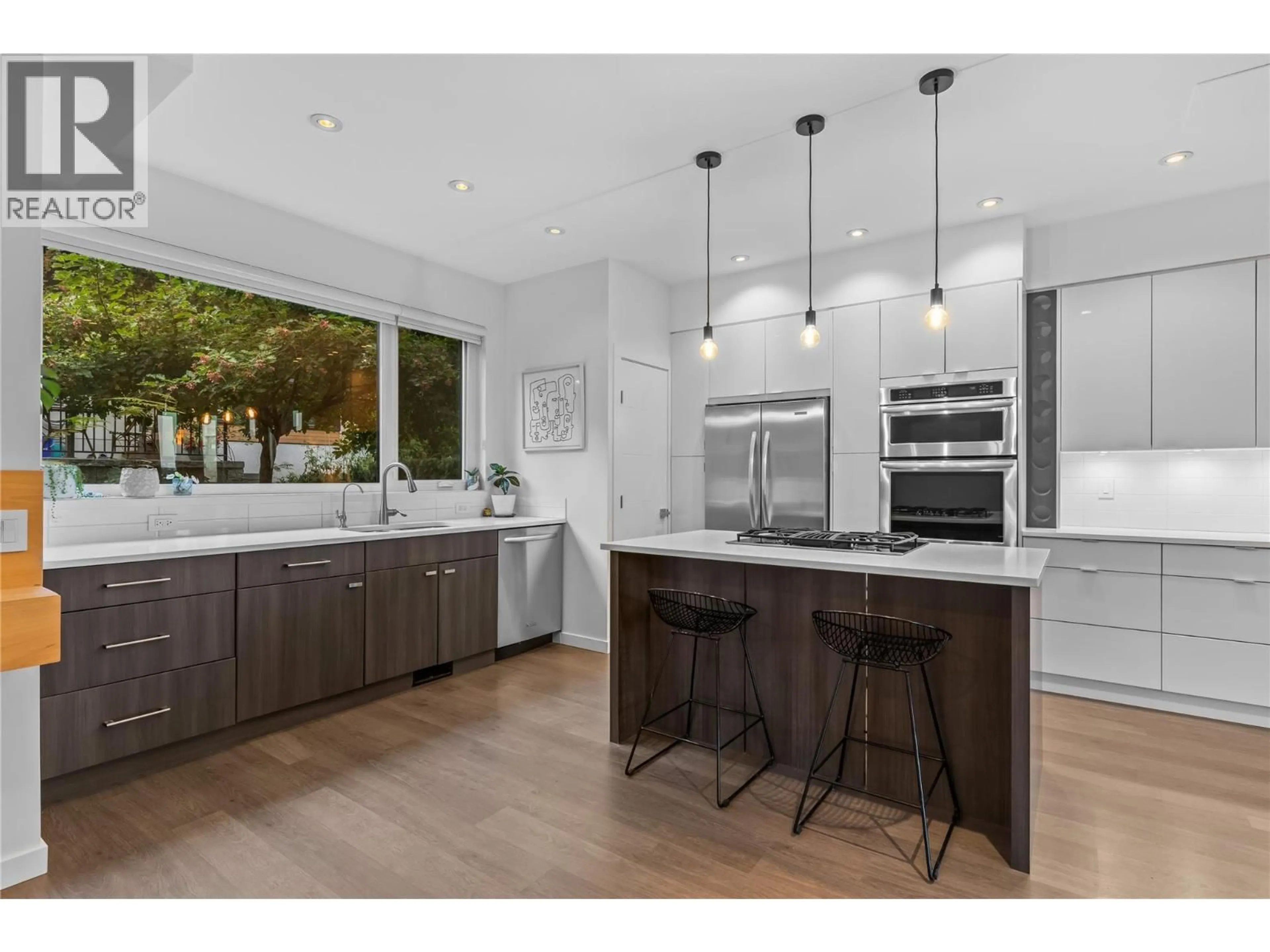 Open concept kitchen, wood/laminate floor for 23 - 1818 PEAK POINT COURT, West Kelowna British Columbia V1Z4B4