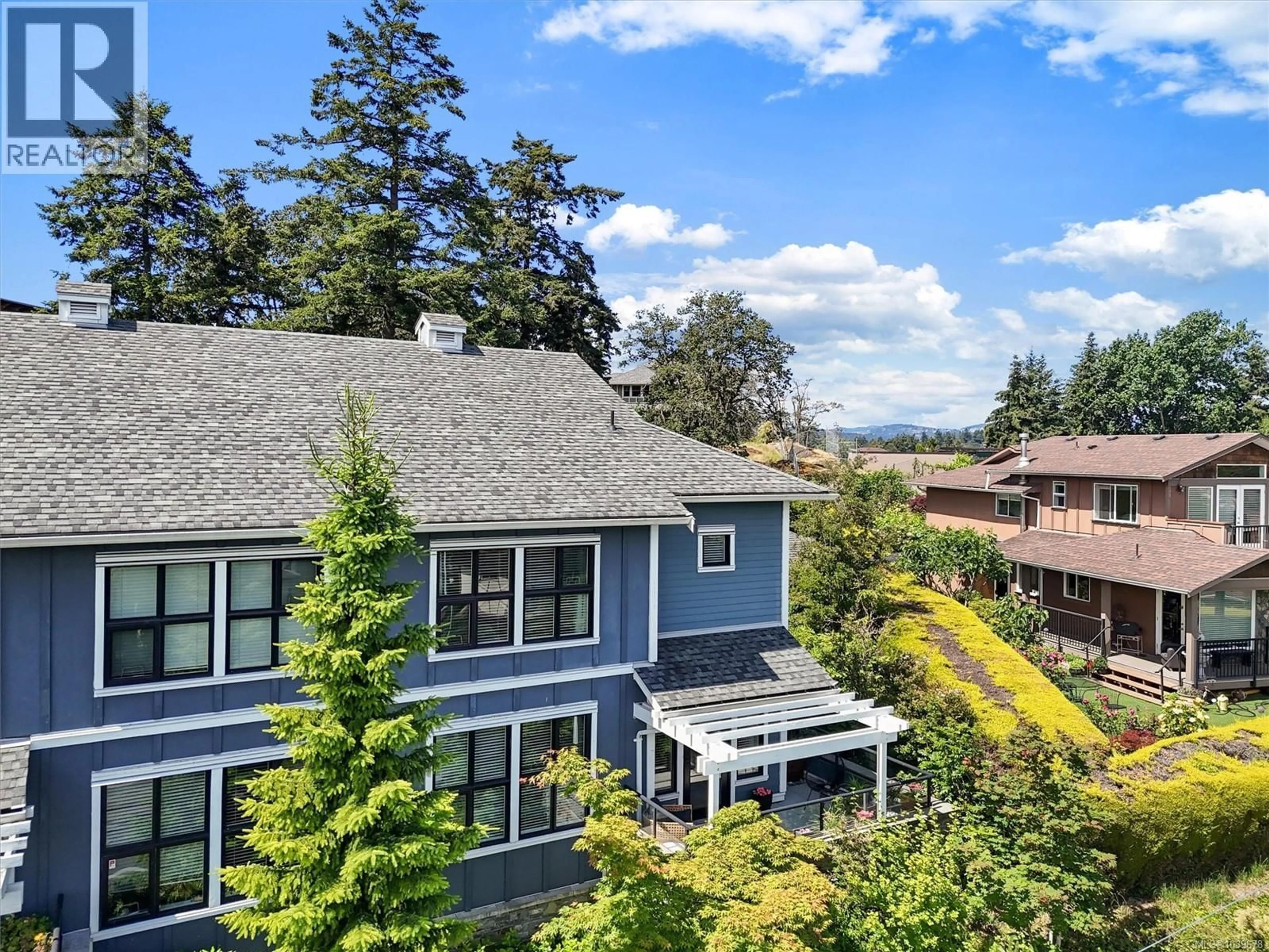 A pic from outside/outdoor area/front of a property/back of a property/a pic from drone, unknown for 101 - 3916 CAREY ROAD, Saanich British Columbia V8Z4E2