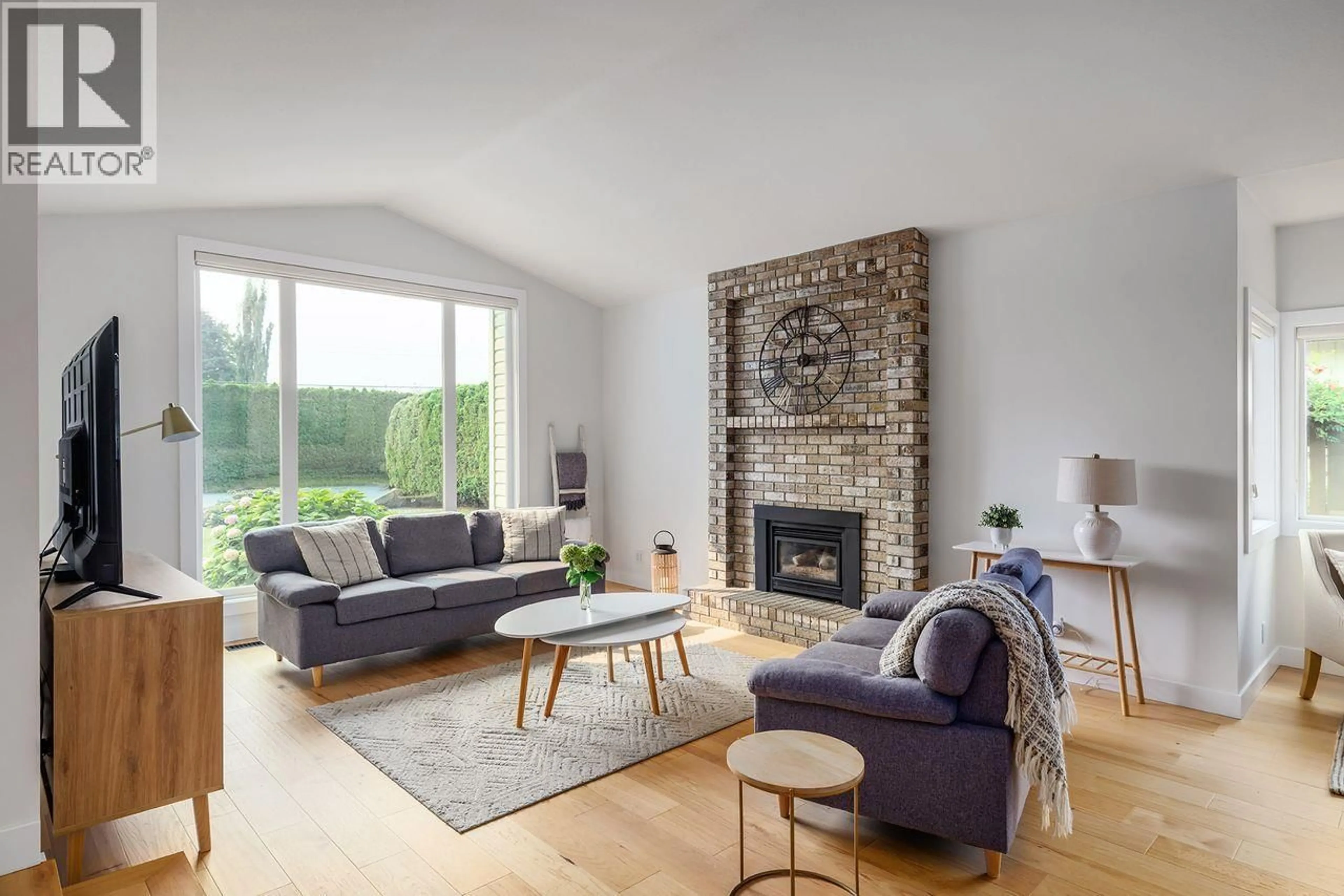 Living room with furniture, wood/laminate floor for 1620 PRITCHARD DRIVE, West Kelowna British Columbia V4T1X3