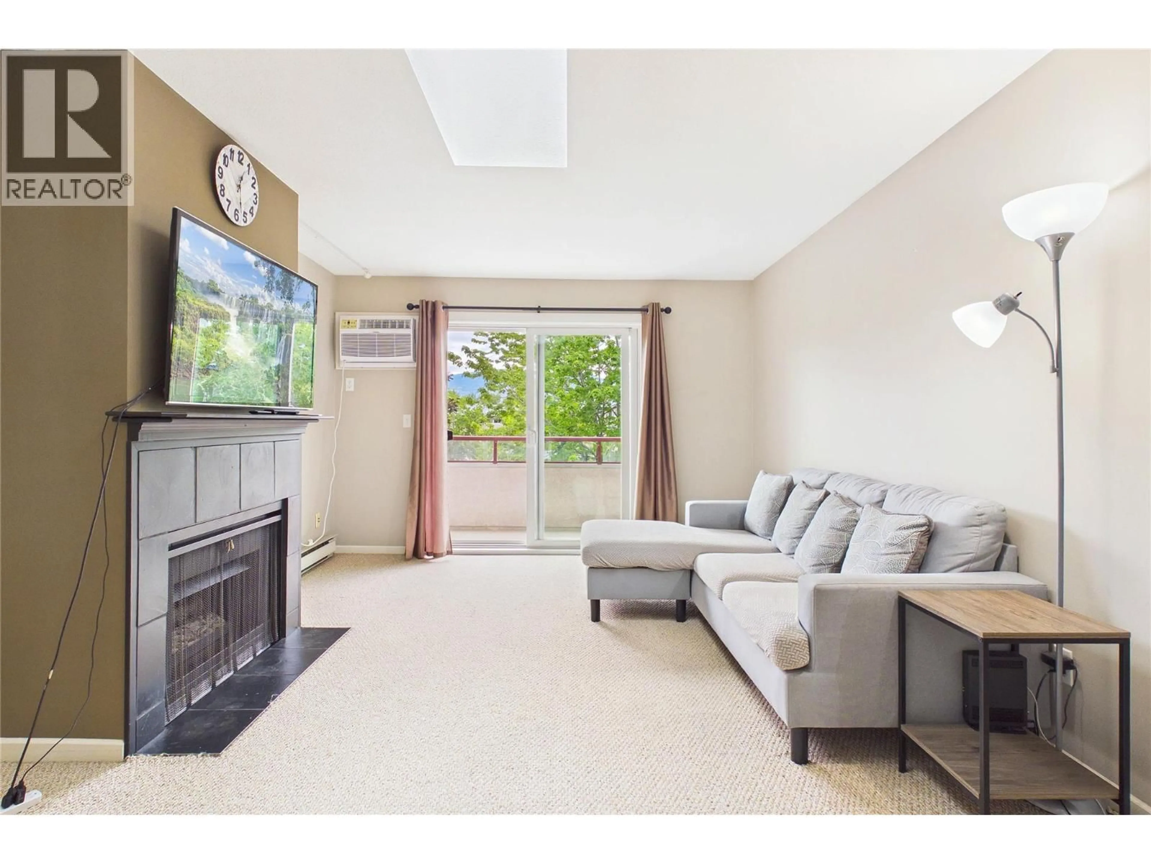 Living room with furniture, unknown for 303 - 993 KLO ROAD, Kelowna British Columbia V4T2M3