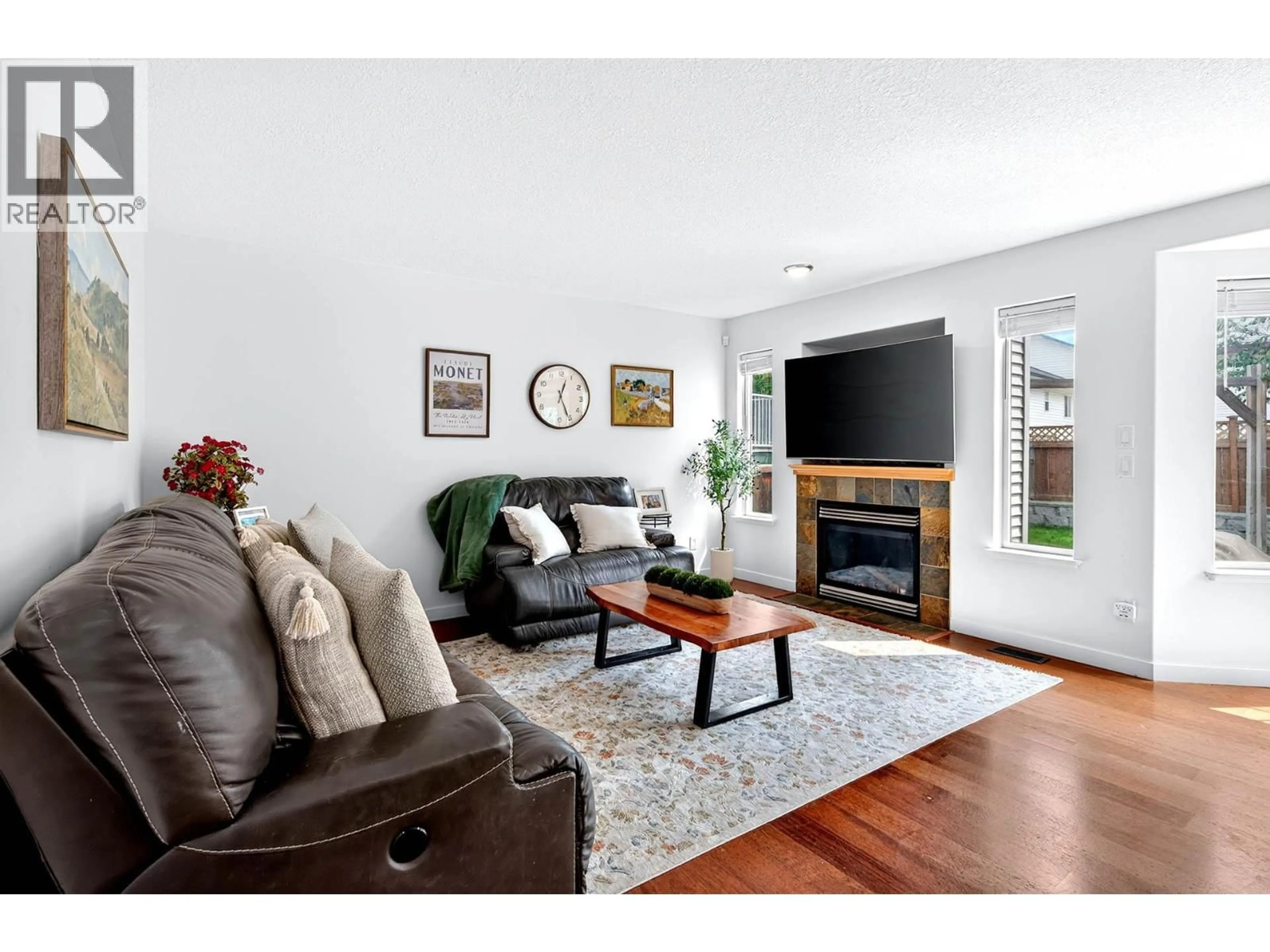 Living room with furniture, wood/laminate floor for 787 BRAMBLE COURT, Kamloops British Columbia V1S1Z5
