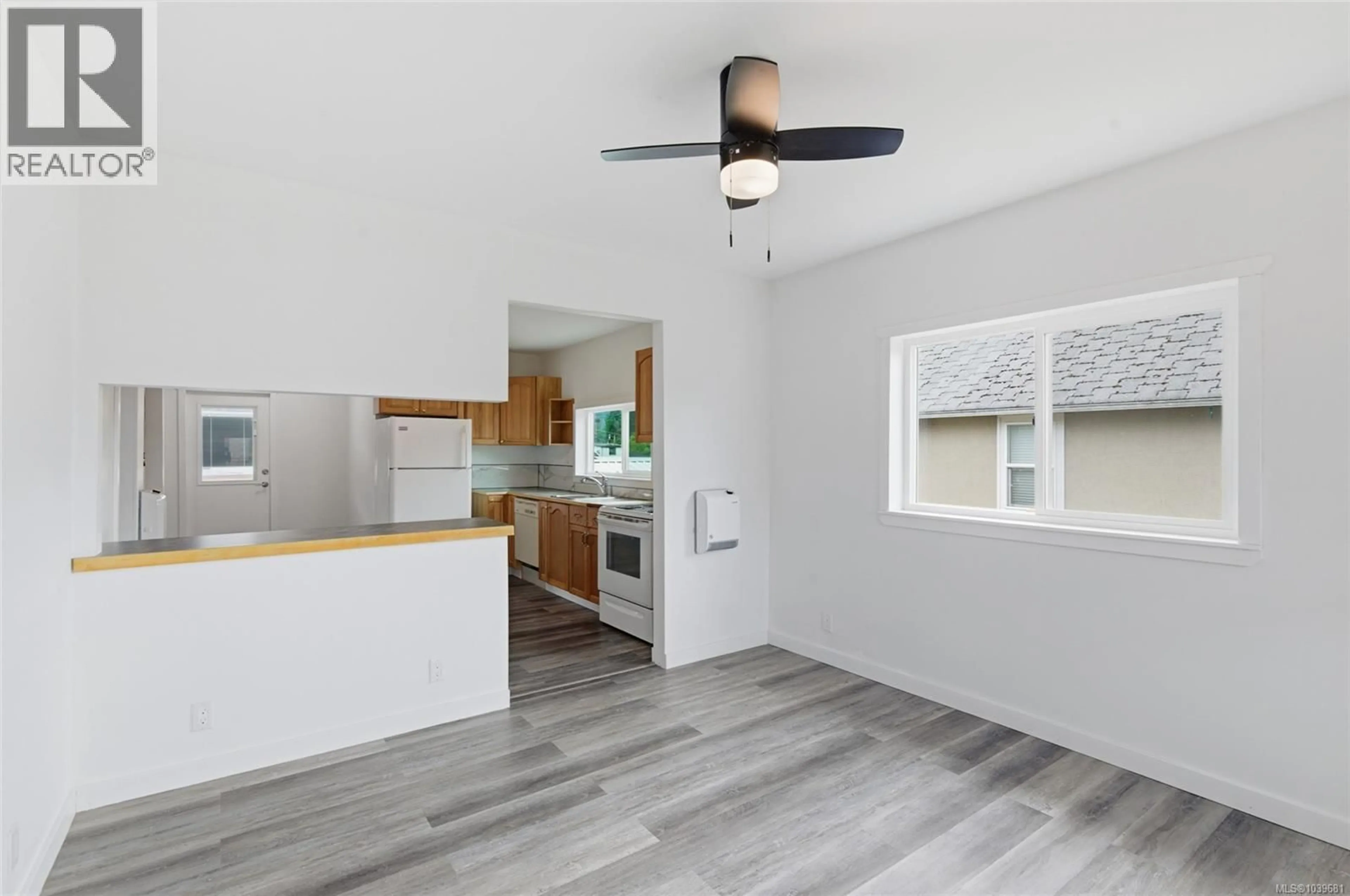 Open concept kitchen, wood/laminate floor for 4524 BUTE STREET, Port Alberni British Columbia V9Y3M9