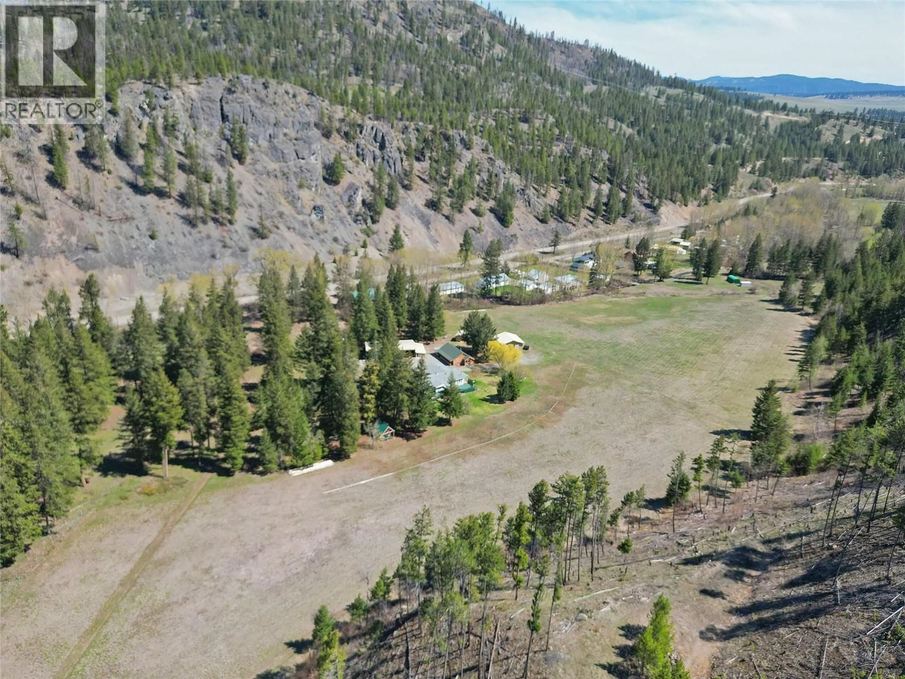 A pic from outside/outdoor area/front of a property/back of a property/a pic from drone, mountain view for 1094 HIGHWAY 5A OTHER, Princeton British Columbia V0X1W0