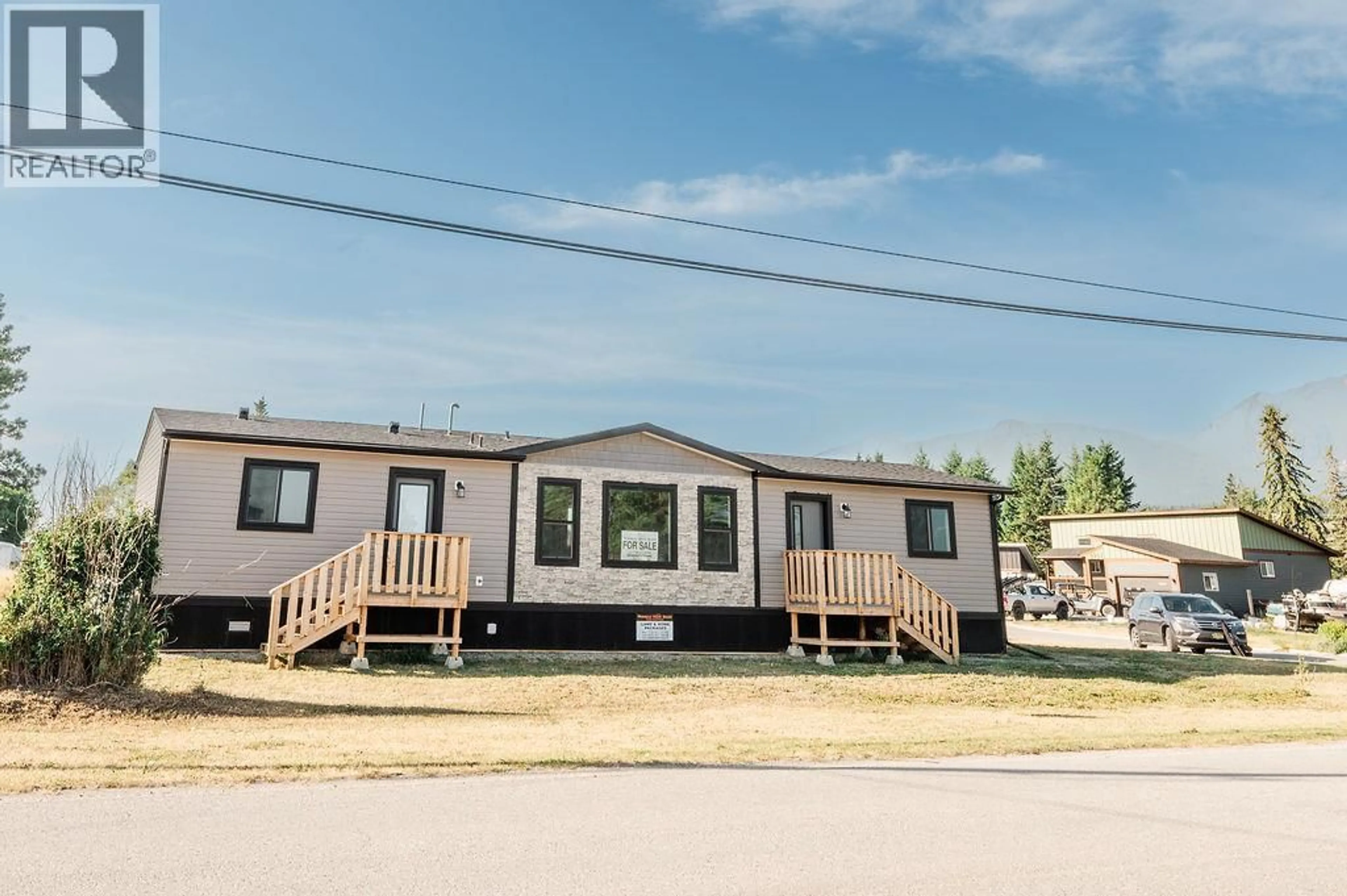 Home with vinyl exterior material, street for 8948 RUNDLE PLACE, Canal Flats British Columbia V0B1B0