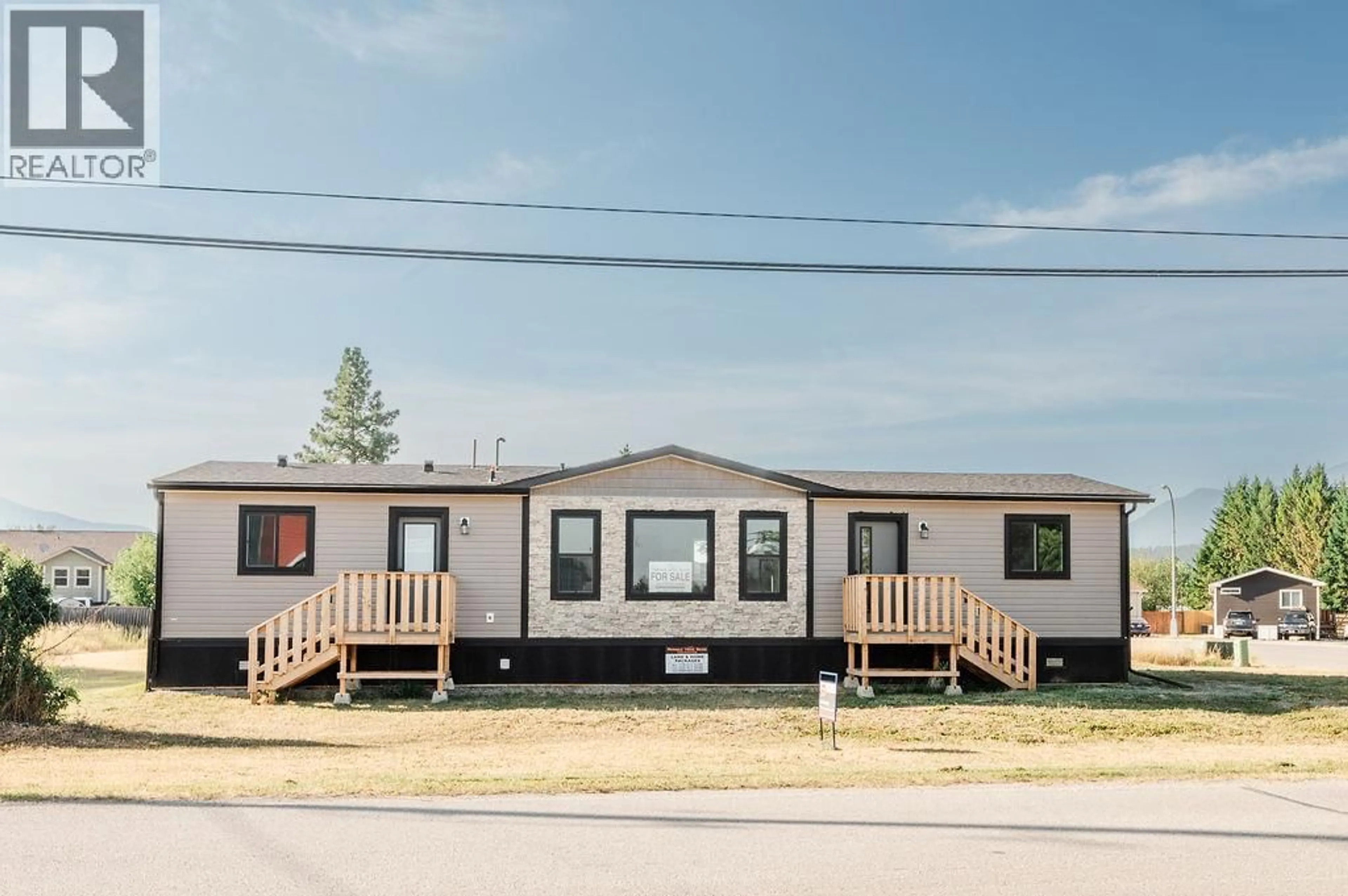 Home with vinyl exterior material, street for 8948 RUNDLE PLACE, Canal Flats British Columbia V0B1B0