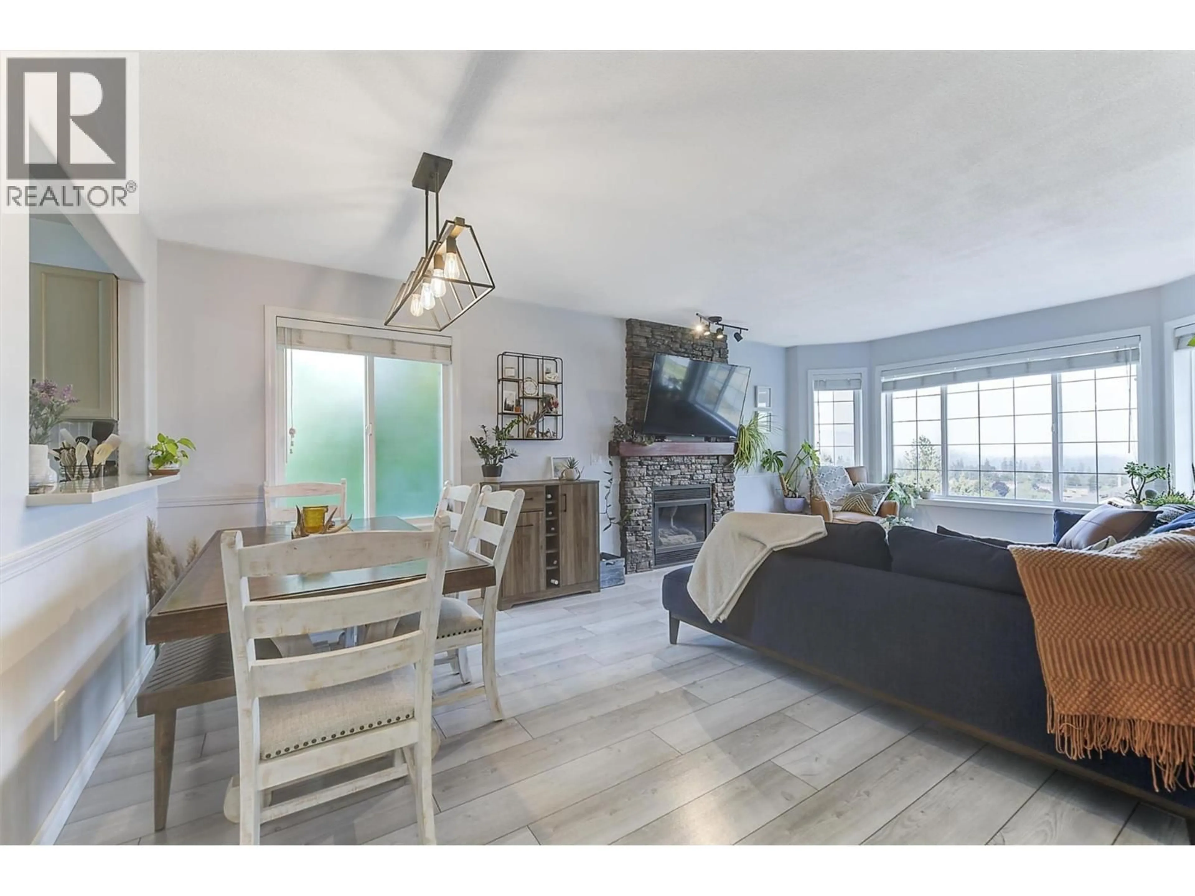 Living room with furniture, wood/laminate floor for 3656 WALNUT GLEN DRIVE, West Kelowna British Columbia V4T2R7