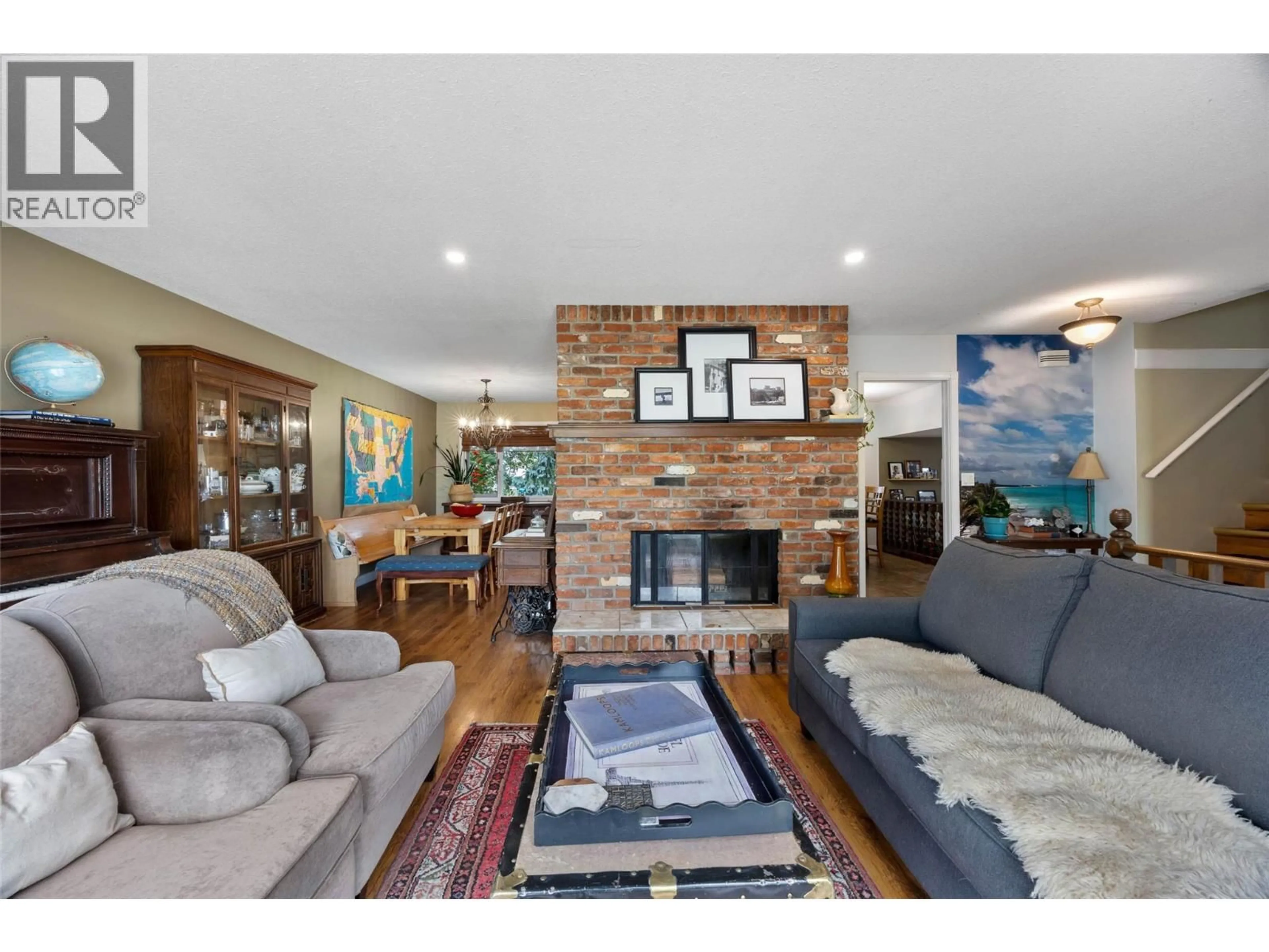 Living room with furniture, wood/laminate floor for 2269 BALFOUR COURT, Kamloops British Columbia V1S1H5