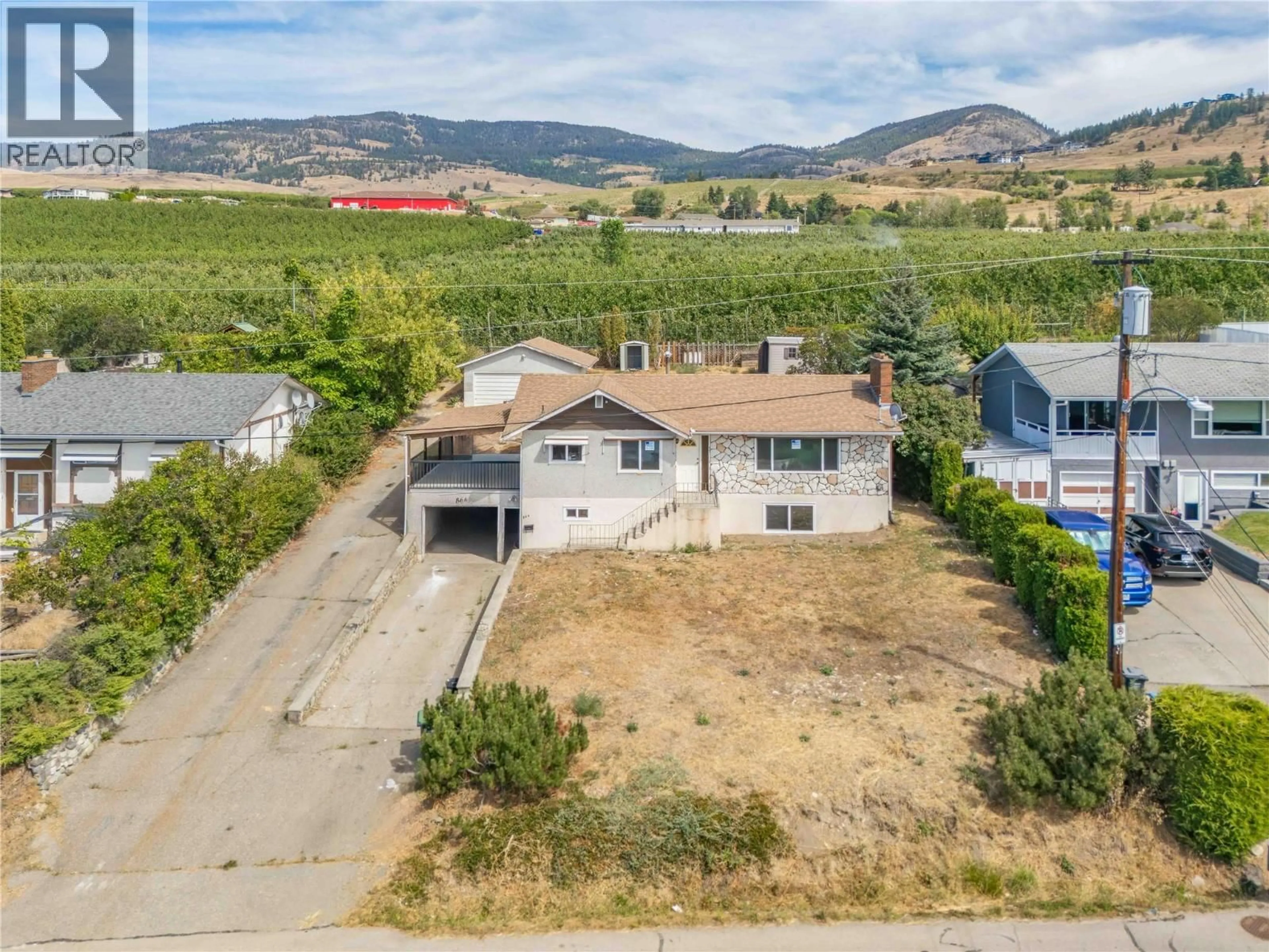 A pic from outside/outdoor area/front of a property/back of a property/a pic from drone, mountain view for 864 MCKENZIE ROAD, Kelowna British Columbia V1X2B3