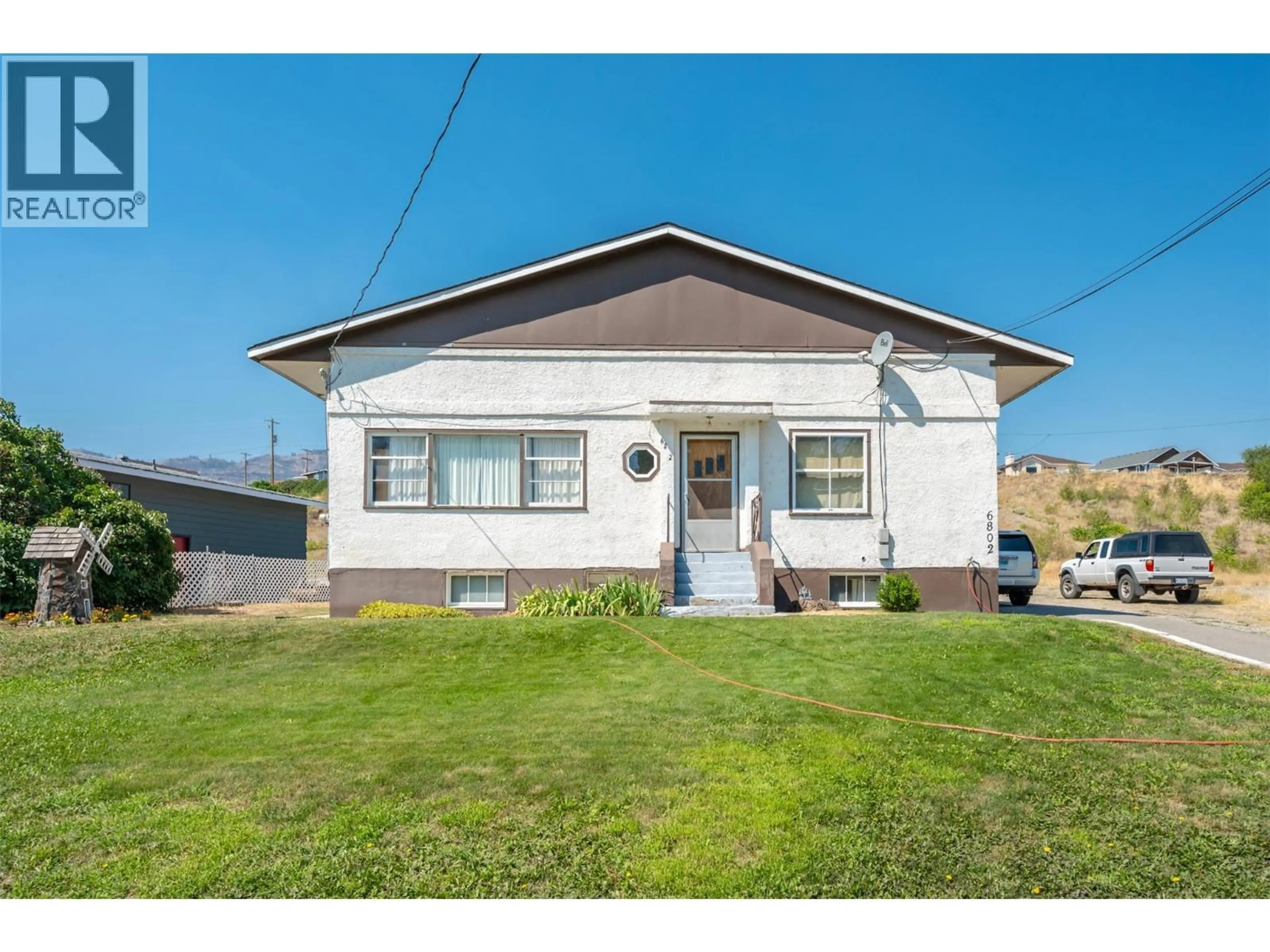 Home with vinyl exterior material, street for 6802 89TH STREET, Osoyoos British Columbia V0H1V1