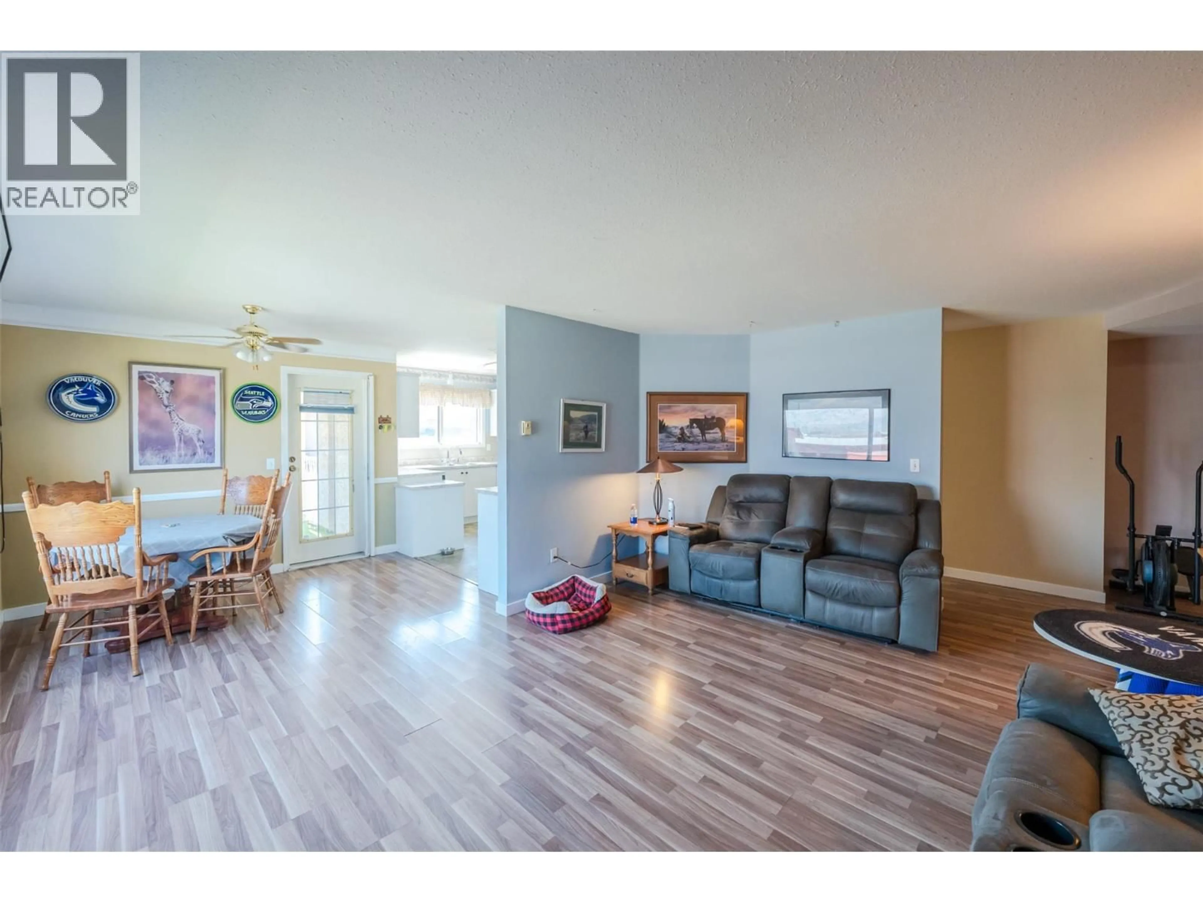 Living room with furniture, wood/laminate floor for 104B - 8006 VEDETTE DRIVE, Osoyoos British Columbia V0H1V0