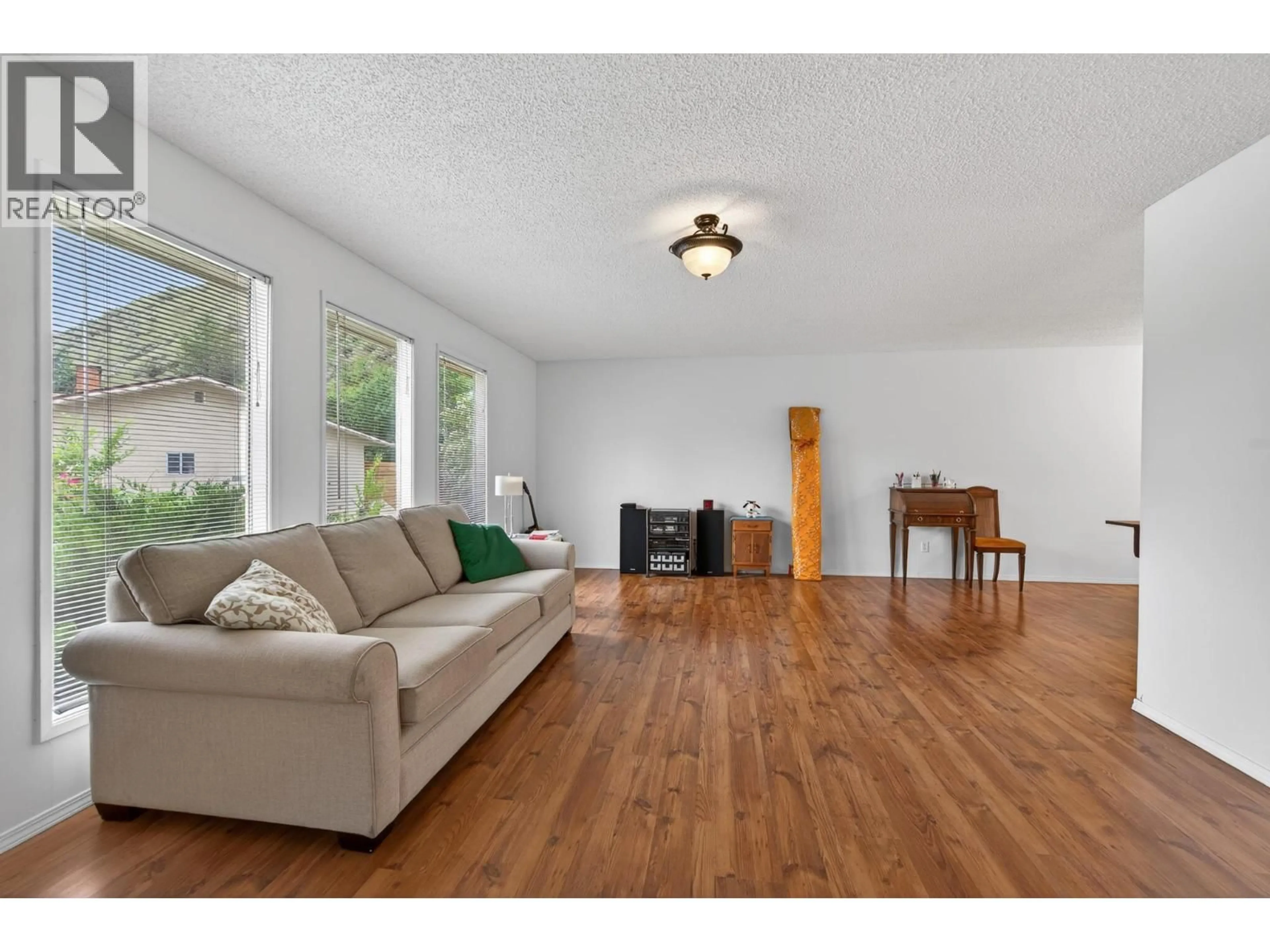 Living room with furniture, wood/laminate floor for 260 MILLER PLACE, Kamloops British Columbia V2C5V8