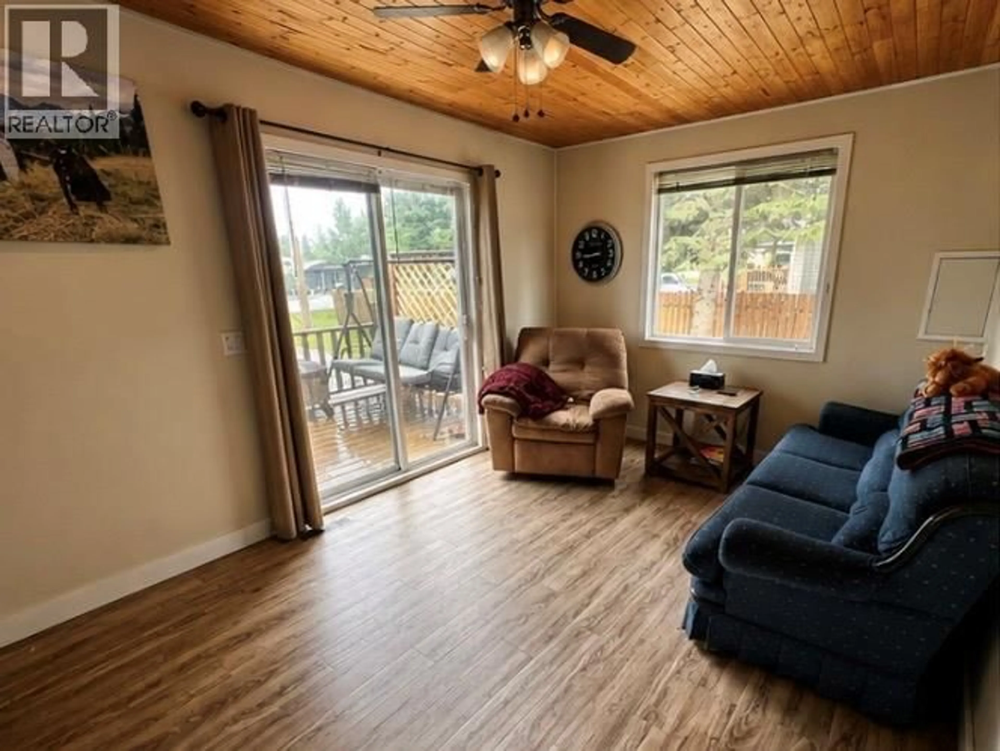 Living room with furniture, wood/laminate floor for 4604 47 AVENUE NORTHEAST, Chetwynd British Columbia V0C1J0